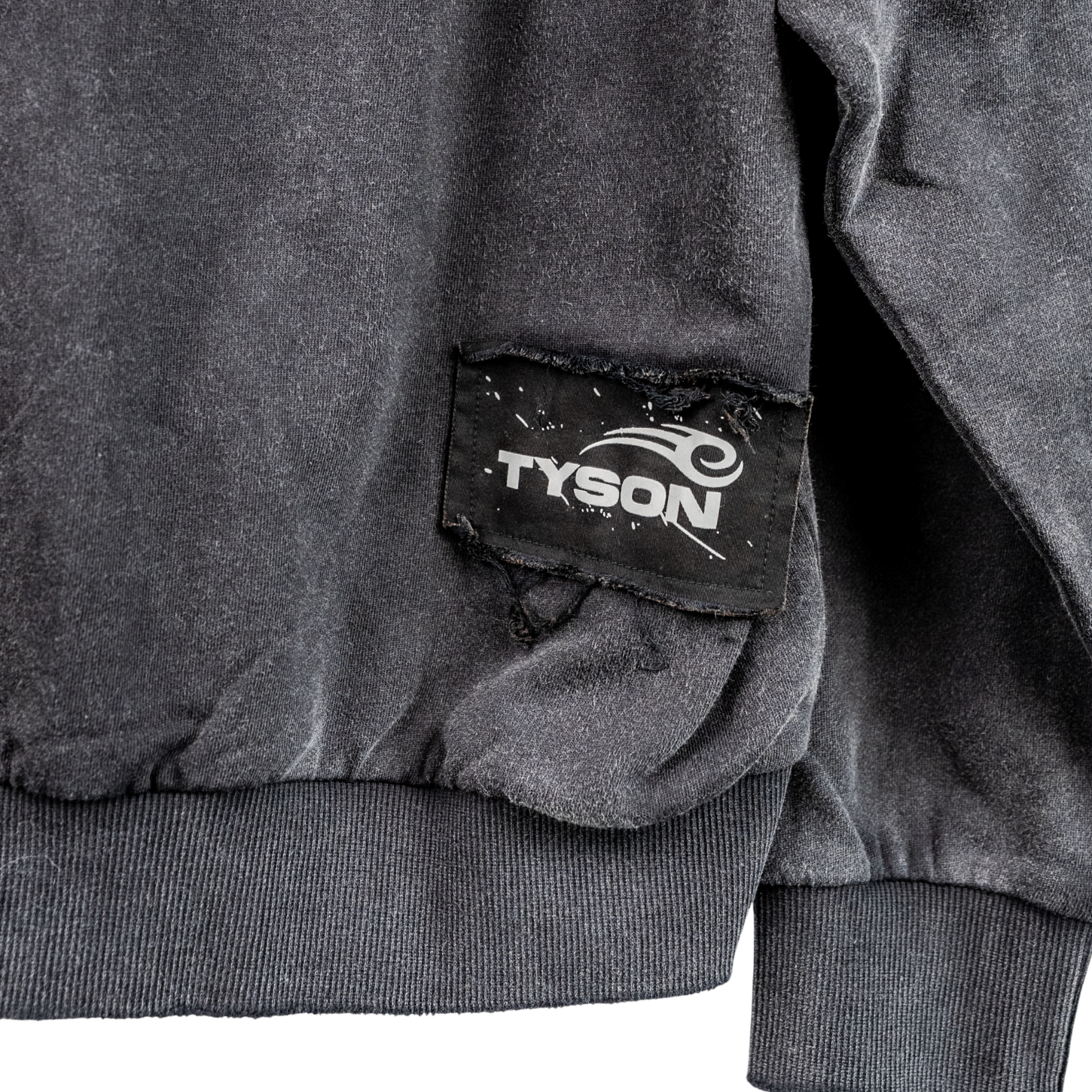 Tyson logo on a black patch on the bottom right of the hoodie's back.