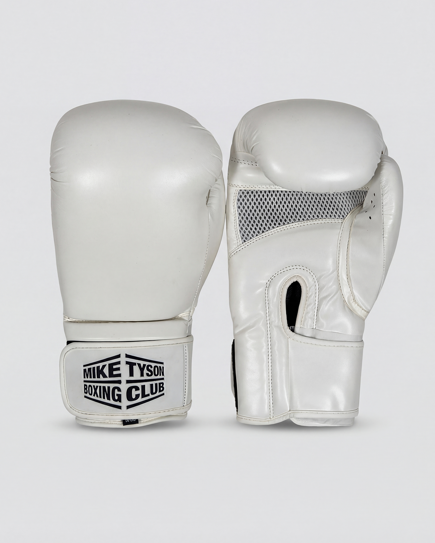White boxing gloves with the Mike Tyson Boxing Club logo in black on the wrist.