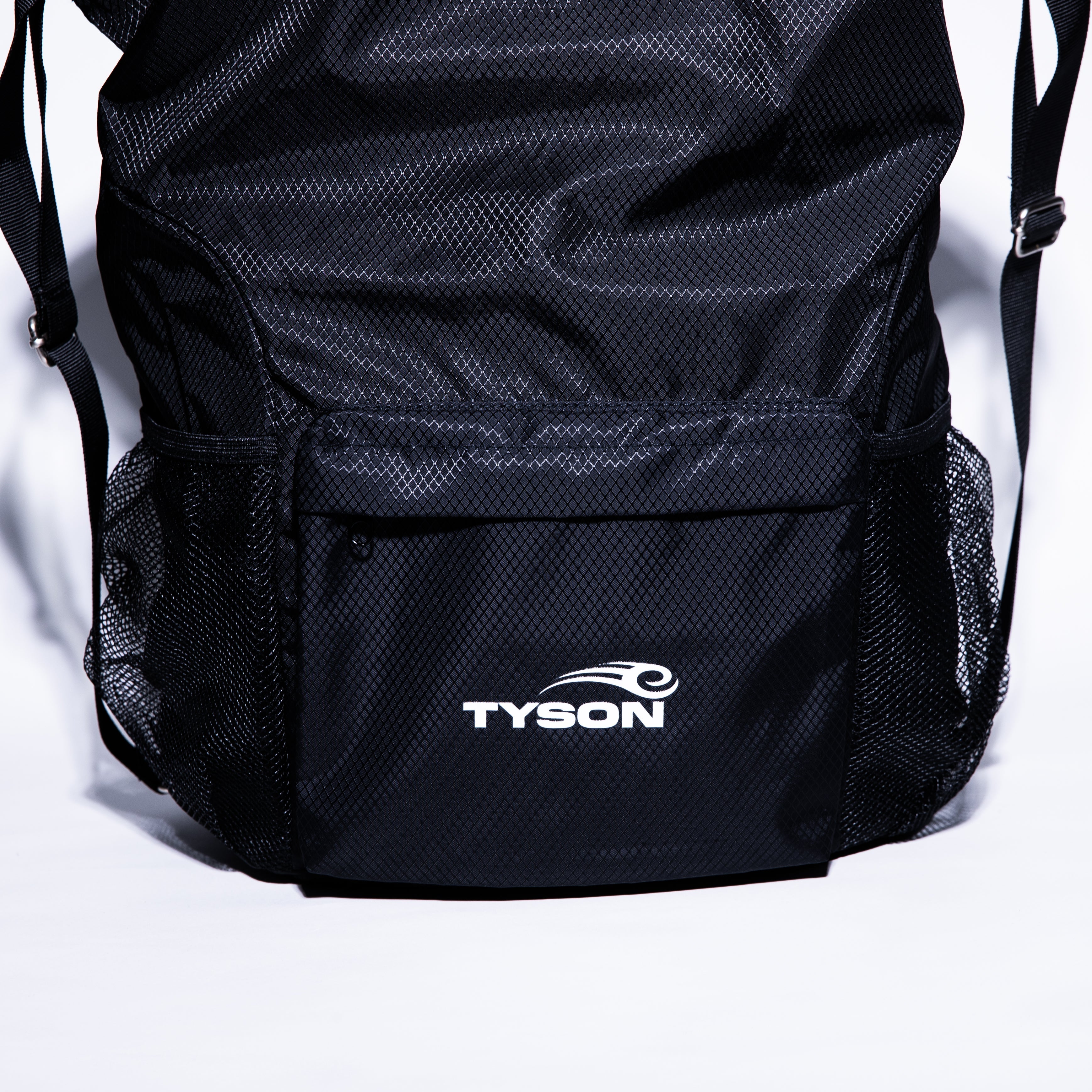 Black drawstring bag featuring the Tyson Pro logo in white on the front pocket panel. The bag has two mesh pockets on either side.