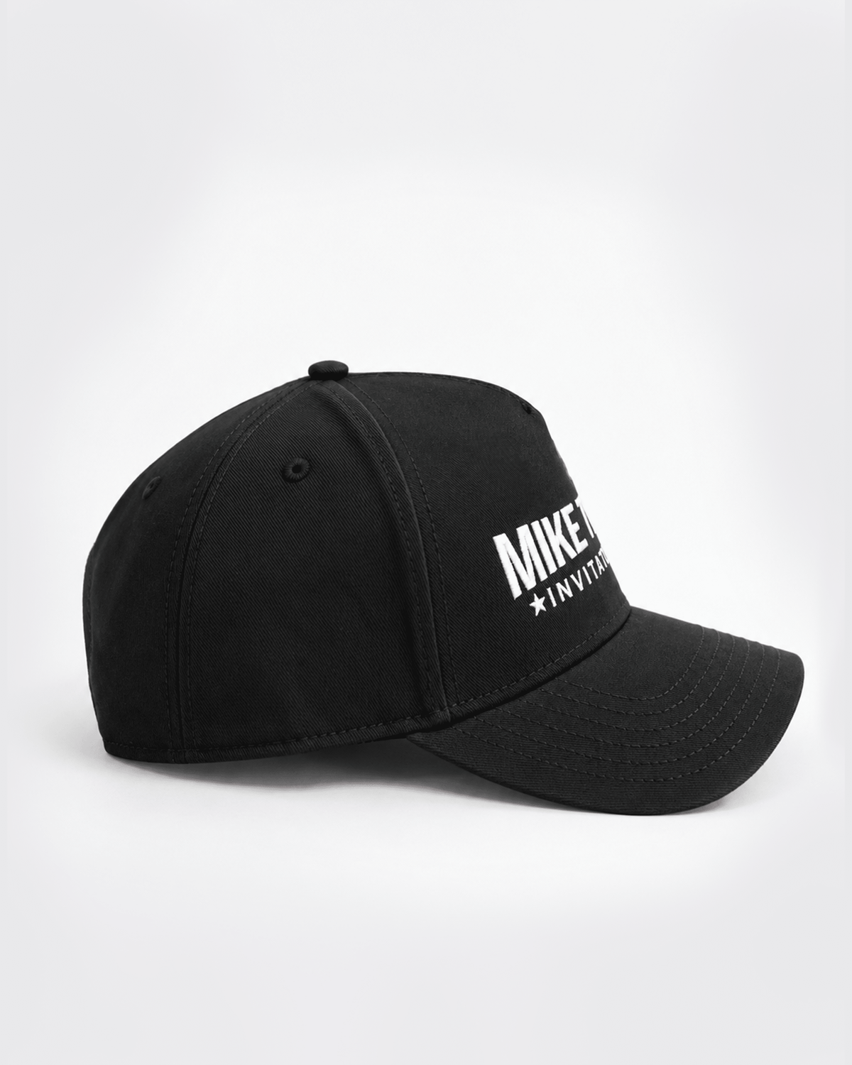 Celebrate the sport's next generation with this Mike Tyson Invitational logo hat. Designed for fans, athletes, and supporters of amateur boxing, this hat features the bold, iconic Invitational logo, whose mission is spotlighting rising talent in the ring.