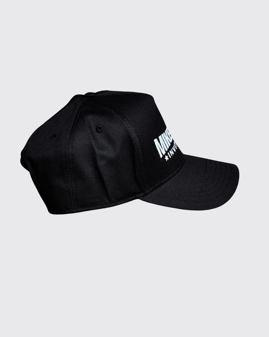 A black hat with the Mike Tyson Invitational Logo on the front panel.
