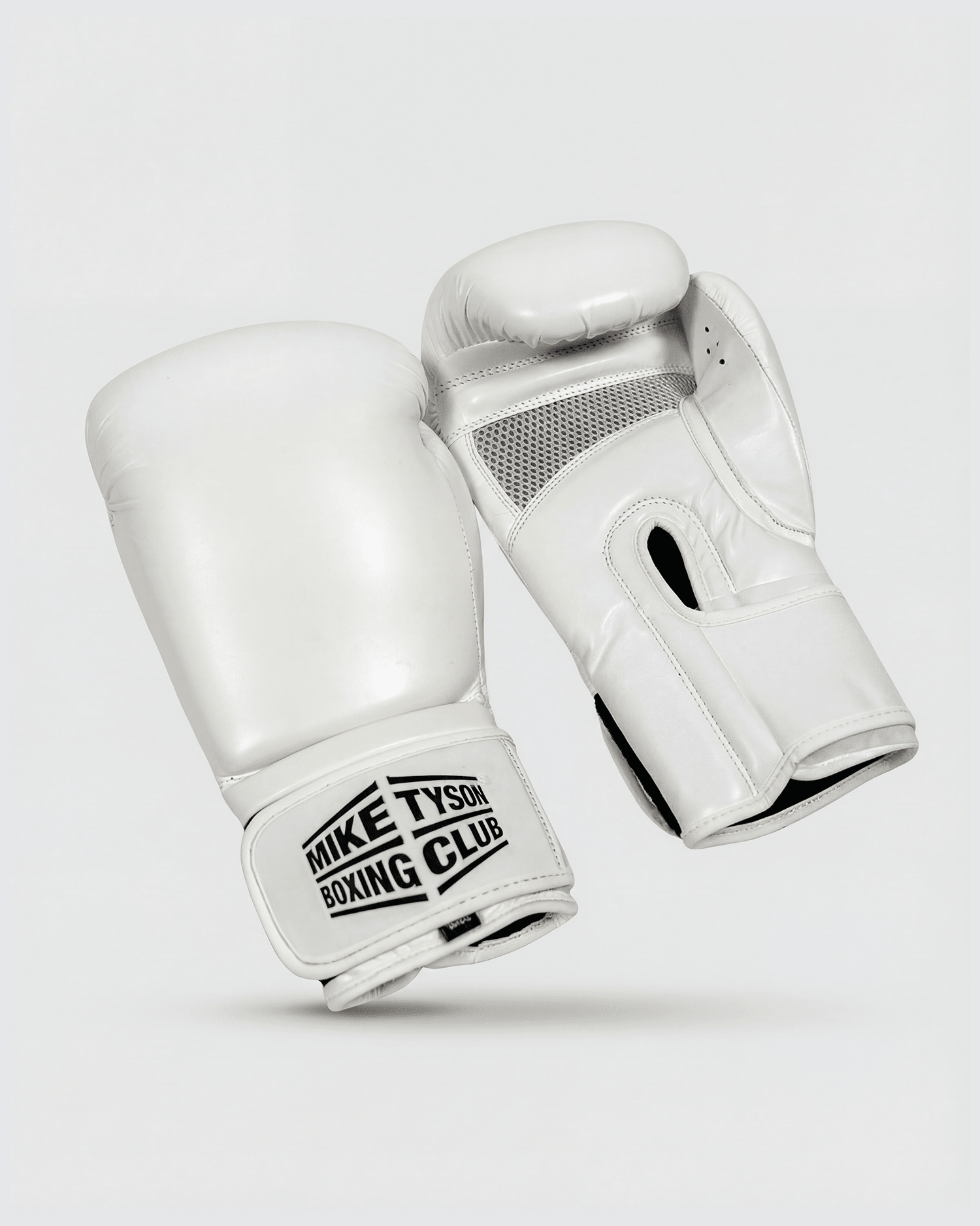 White boxing gloves with the Mike Tyson Boxing Club logo in black on the wrist.
