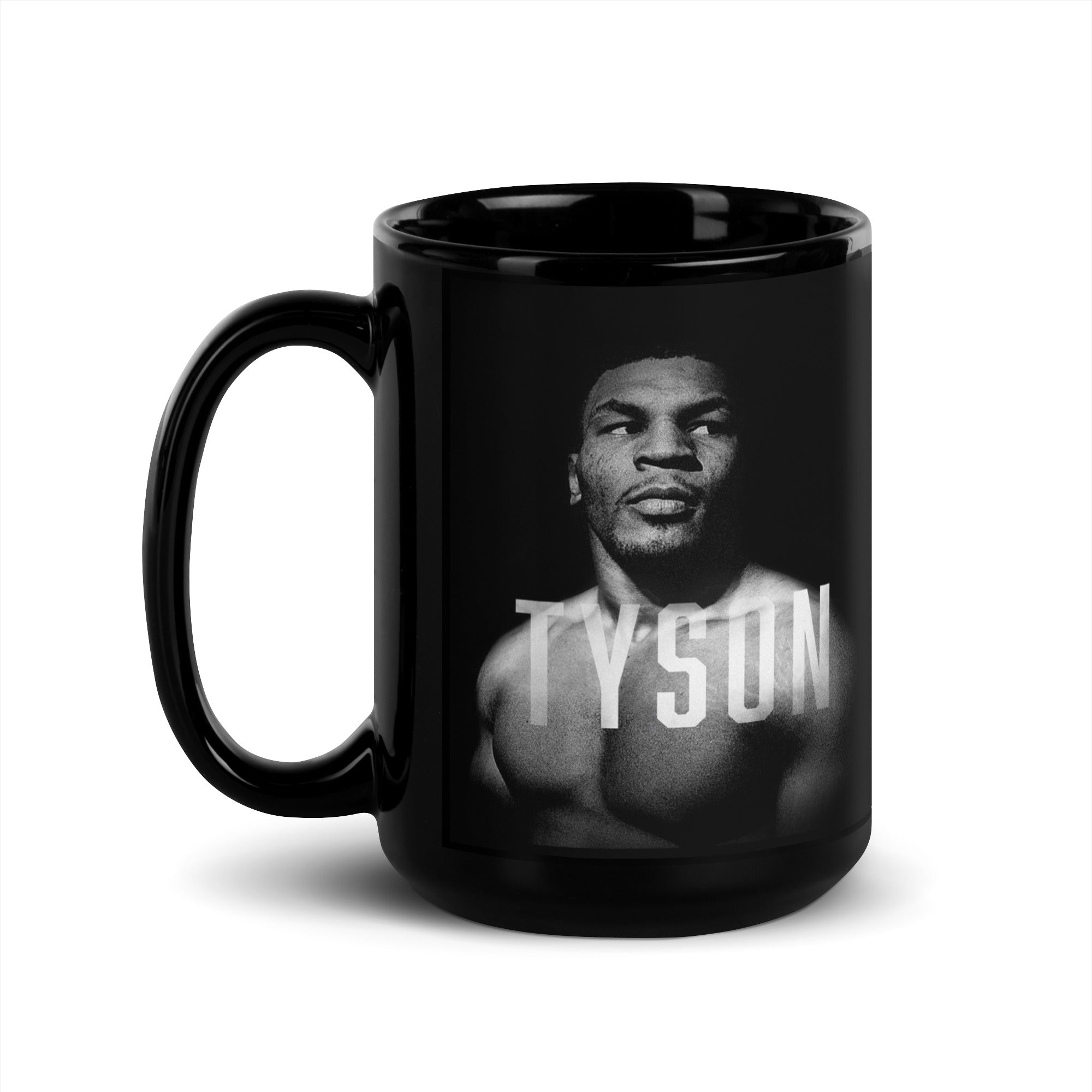 Black Mug with a black and white portrait of Mike. His body is turned slightly to the left, his face is forward and his eyes are looking off to the right. Slightly transparent white text saying "Tyson" is featured across his upper chest.