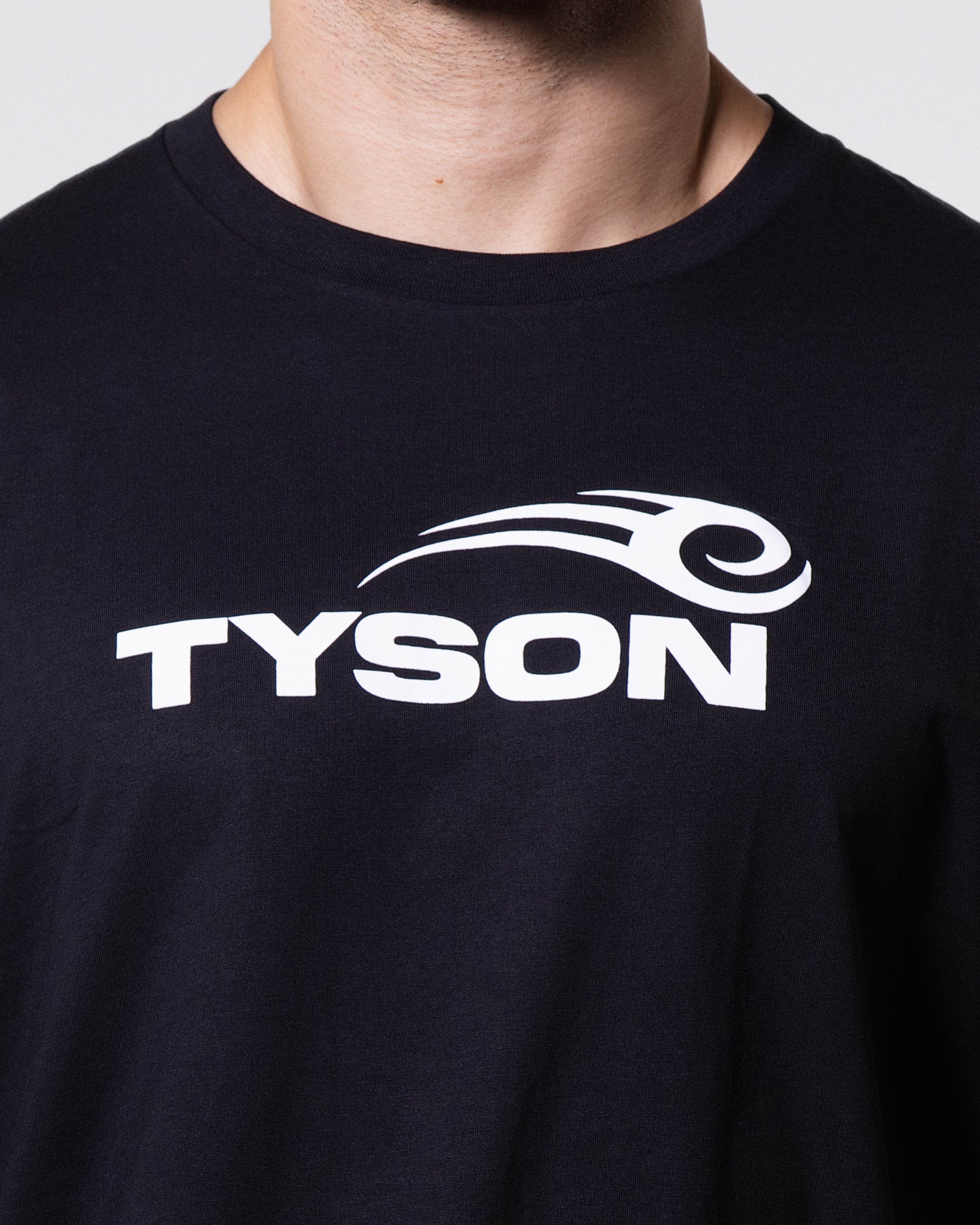 Black T-shirt prominently featuring the Tyson Pro logo in white across the chest.
