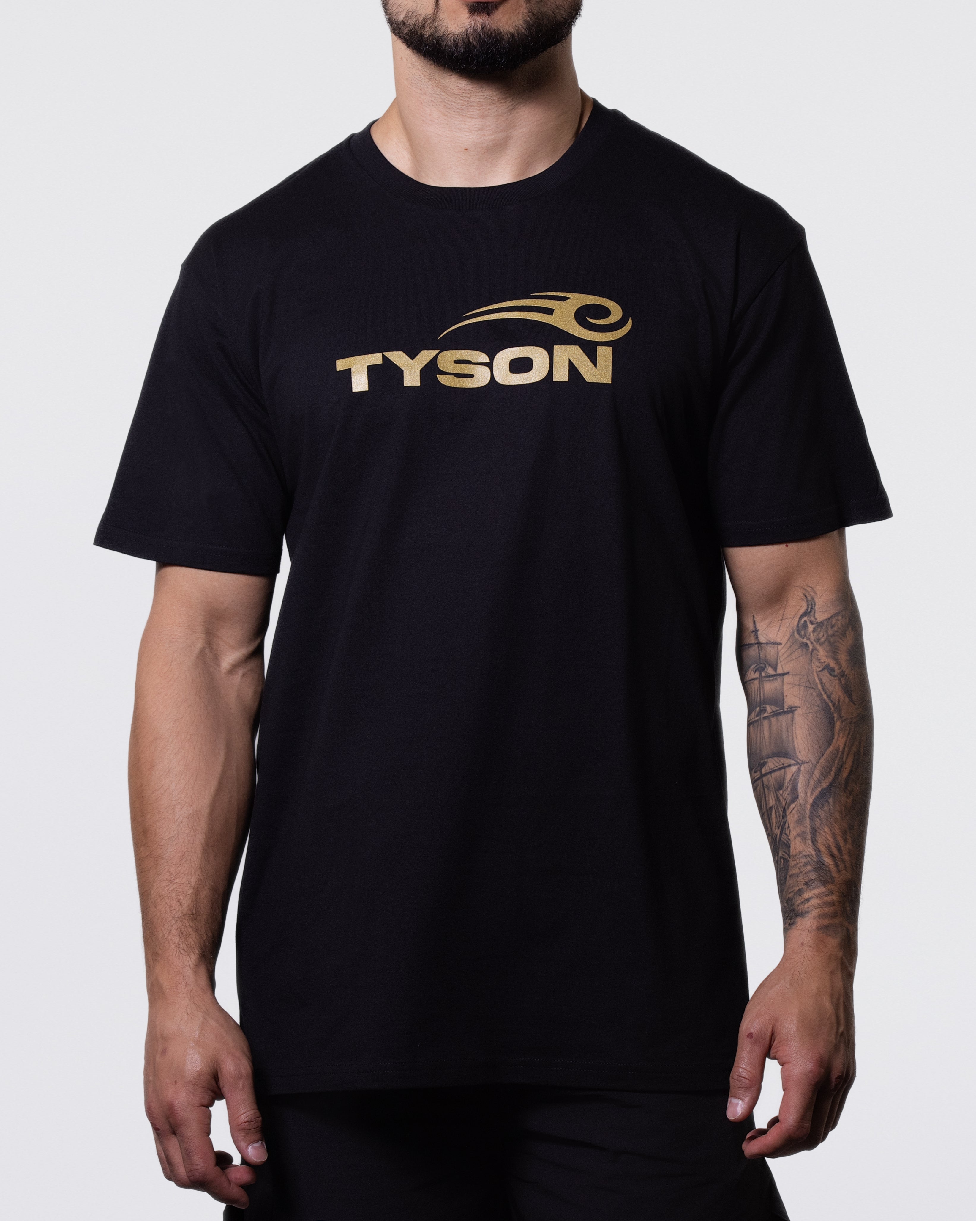 Black T-shirt prominently featuring the Tyson Pro logo in gold across the chest.