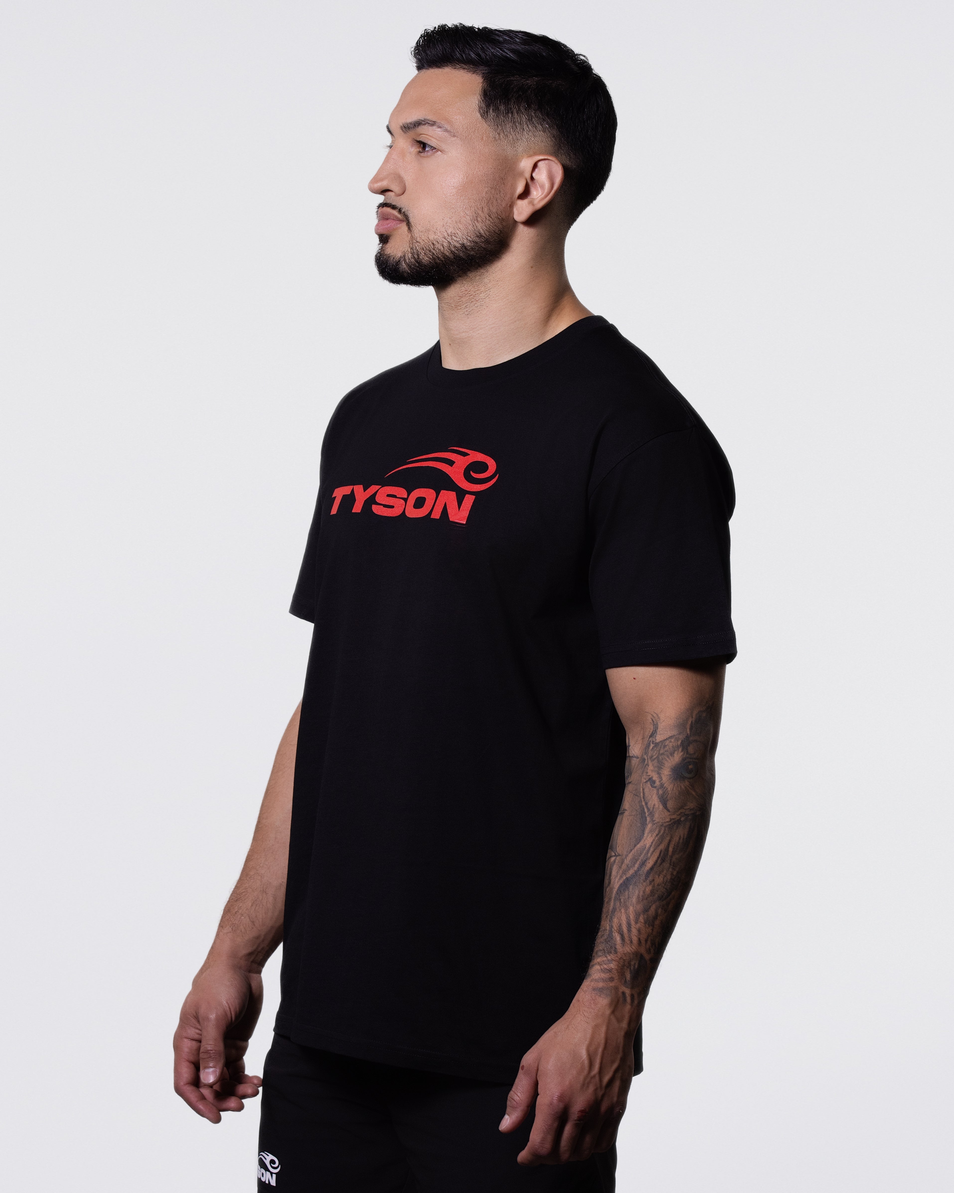 Model wearing the Tyson Pro Cotton Shirt - Black (Red Logo).