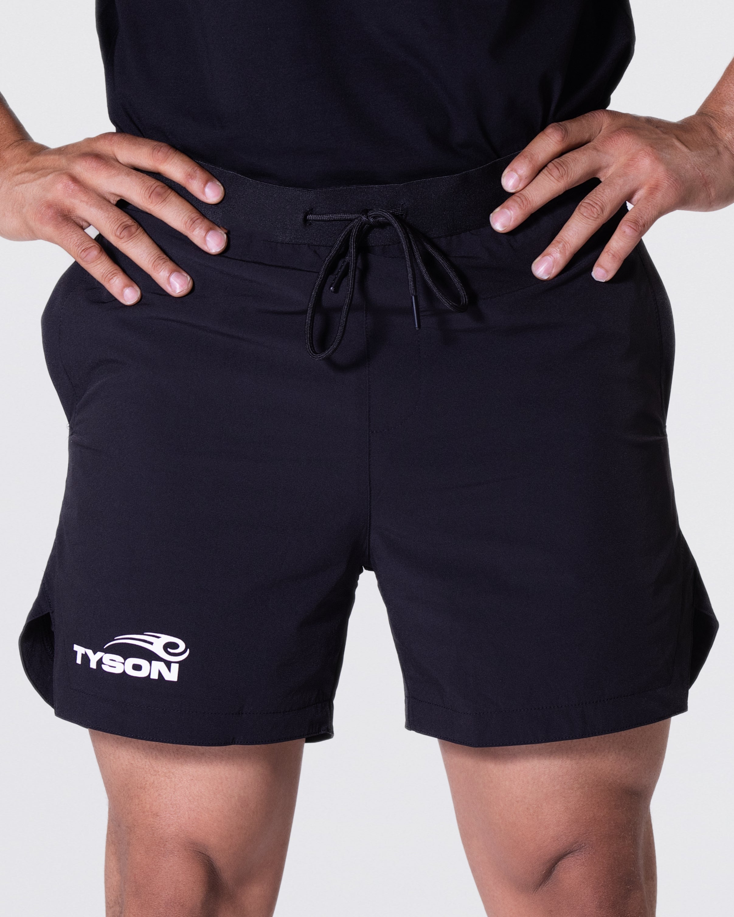 Black shorts featuring the Tyson Pro logo in white on the right thigh, just above the cuff.