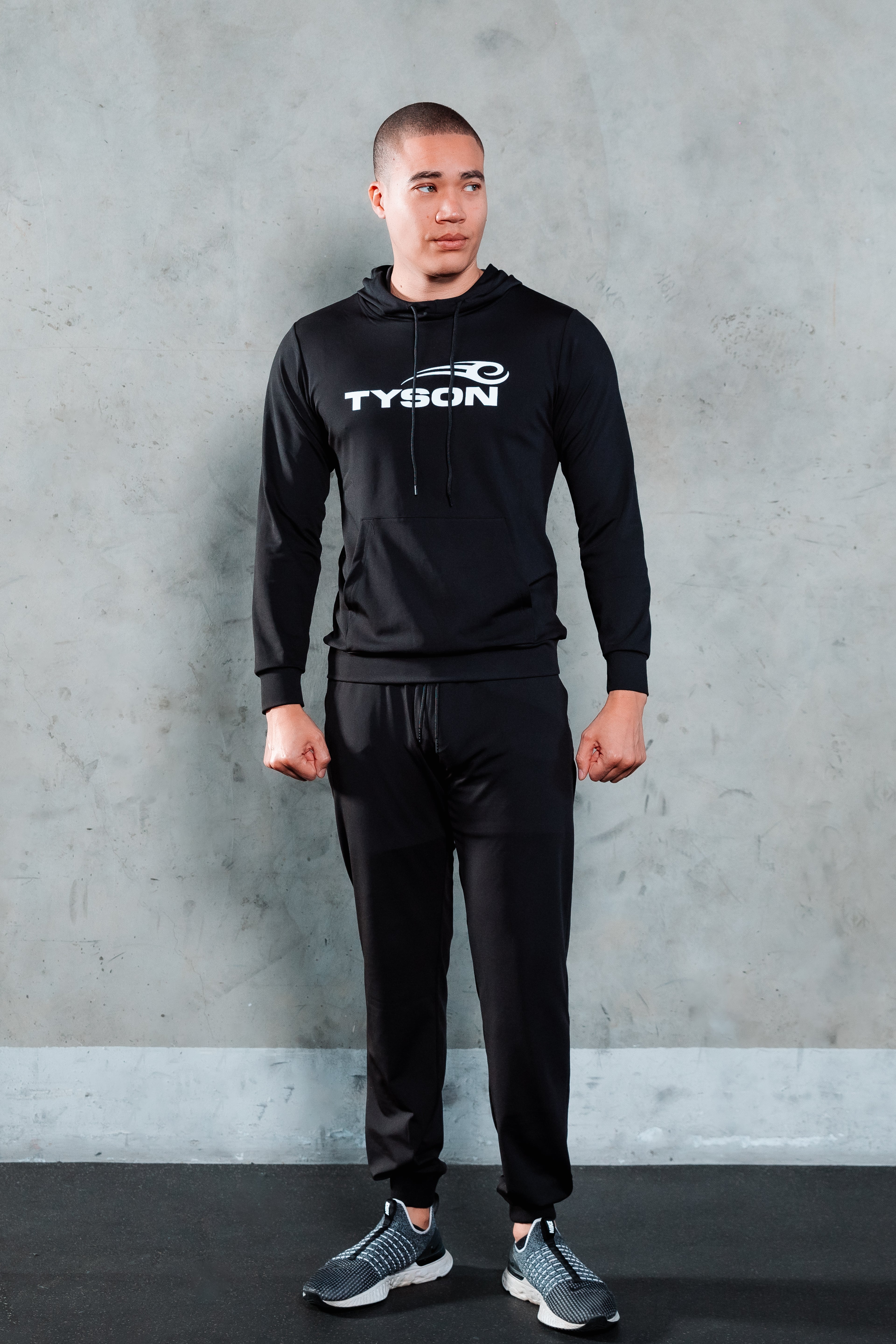 Model wearing the Tyson Pro Performance Hoodie.