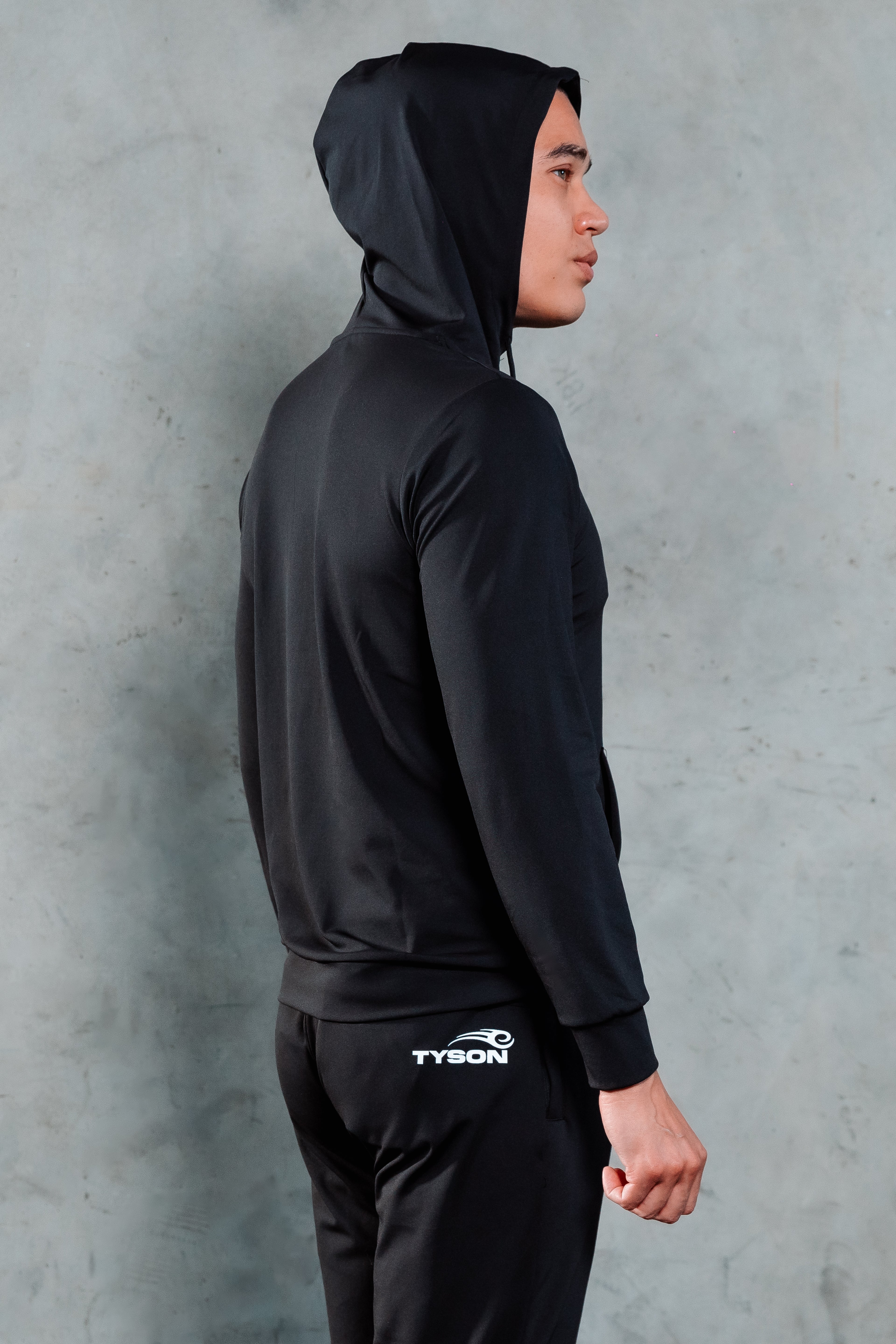 Model wearing the Tyson Pro Performance Hoodie.