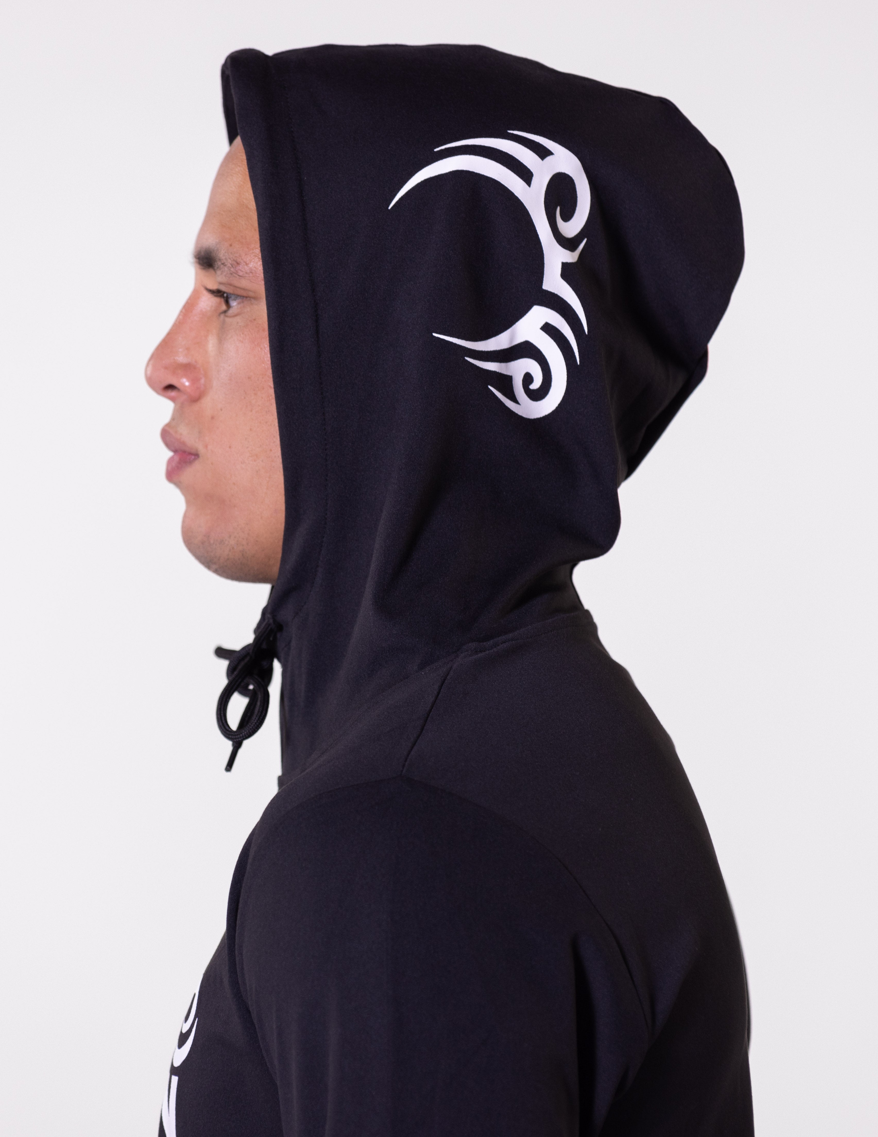 Black hoodie prominently featuring the Tyson Pro logo in white across the chest. Mike Tyson's face tattoo design is on the left side of the hood.