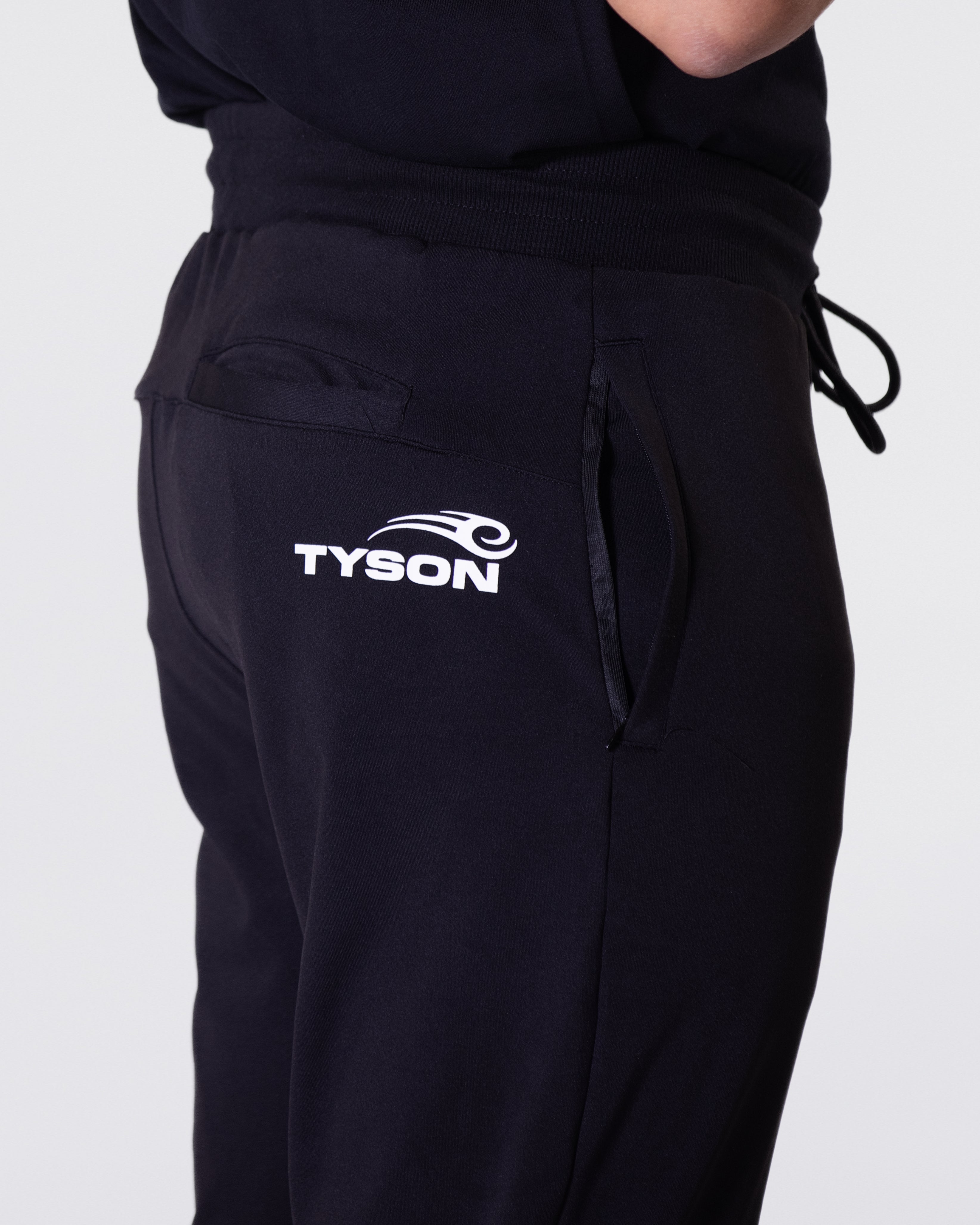 Black jogger featuring the Tyson Pro logo in white on the right hip, just behind the seam.
