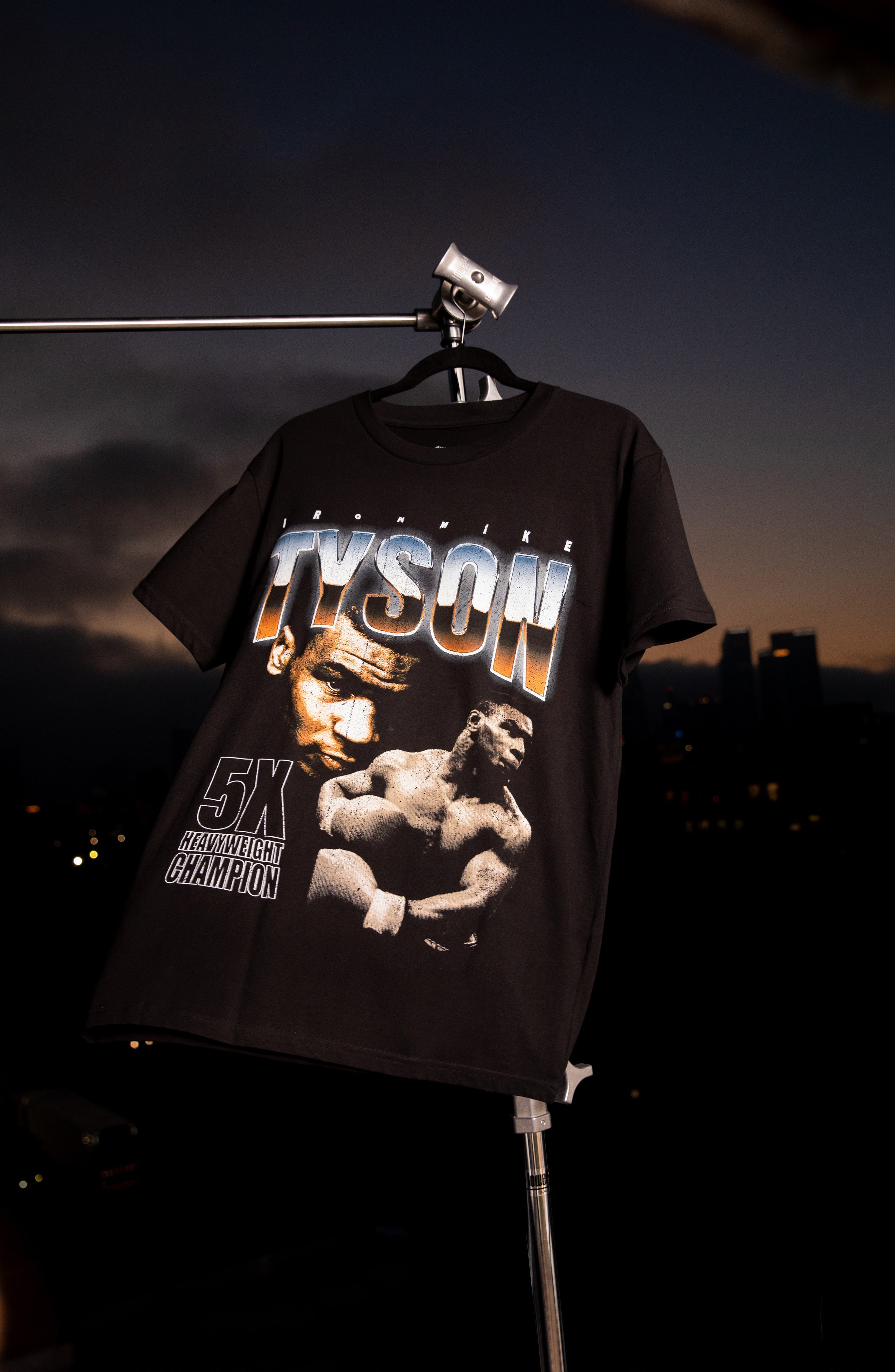 Black T-shirt with 2 images of Mike Tyson: One portrait and the other mid-punch. "Tyson" is written across the top.