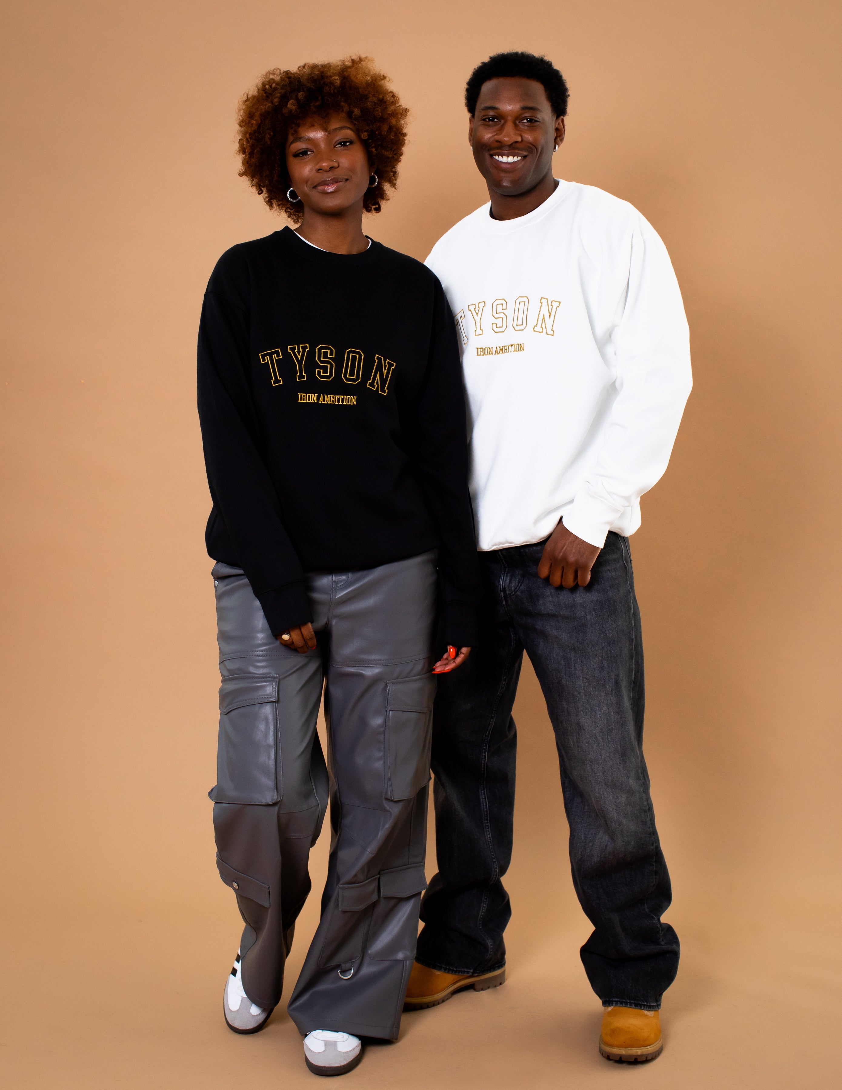 Male and female models wearing the Iron Ambition crewneck sweatshirt.