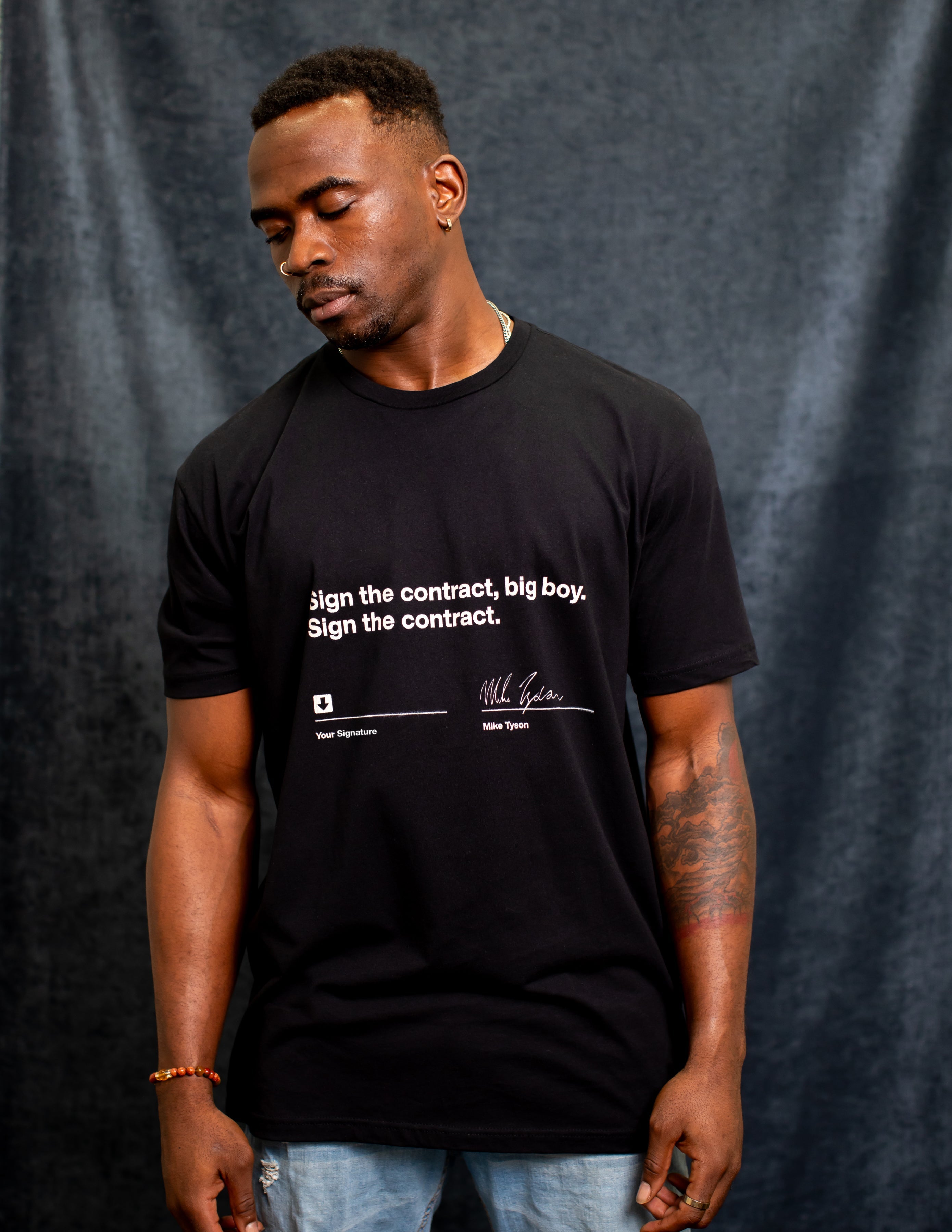 Model wearing the Sign the Contract tee.