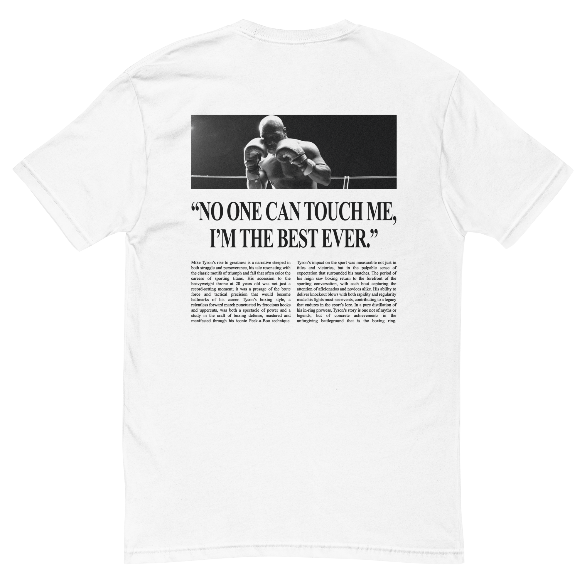 White T-shirt with a graphic on the back in the style of a newspaper article. Across the top, there is a photo of Mike in a ring. Below the image, a large headline reads "No One Can Touch Me, I'm the Best Ever." The article below discusses Mike's road to greatness.