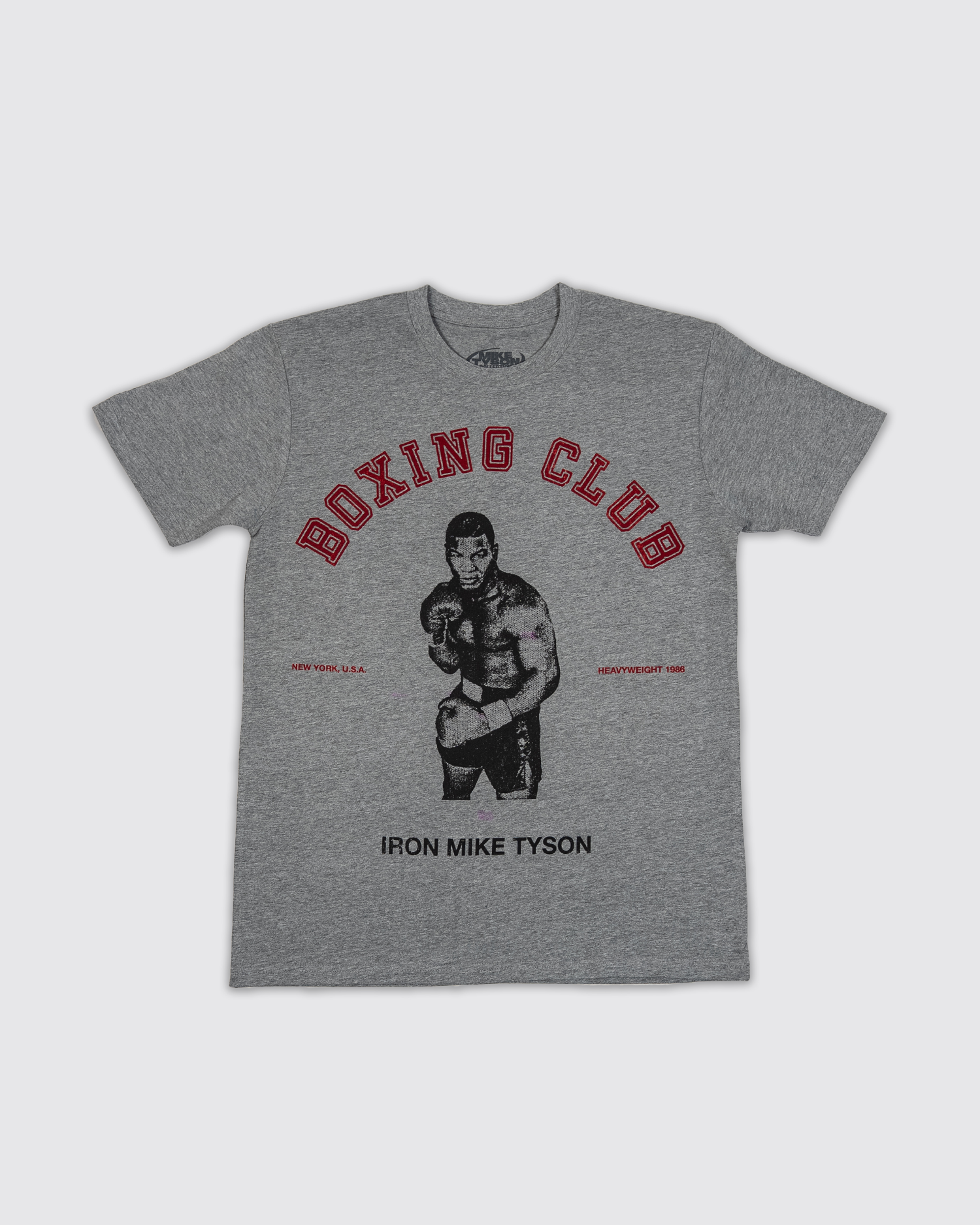 Front design: Gray t-shirt with image of Mike Tyson in the middle, with red "Boxing Club" text over the top, "New York, USA" and "Heavyweight 1986" on the right and left, and black "Iron Mike Tyson" text below.