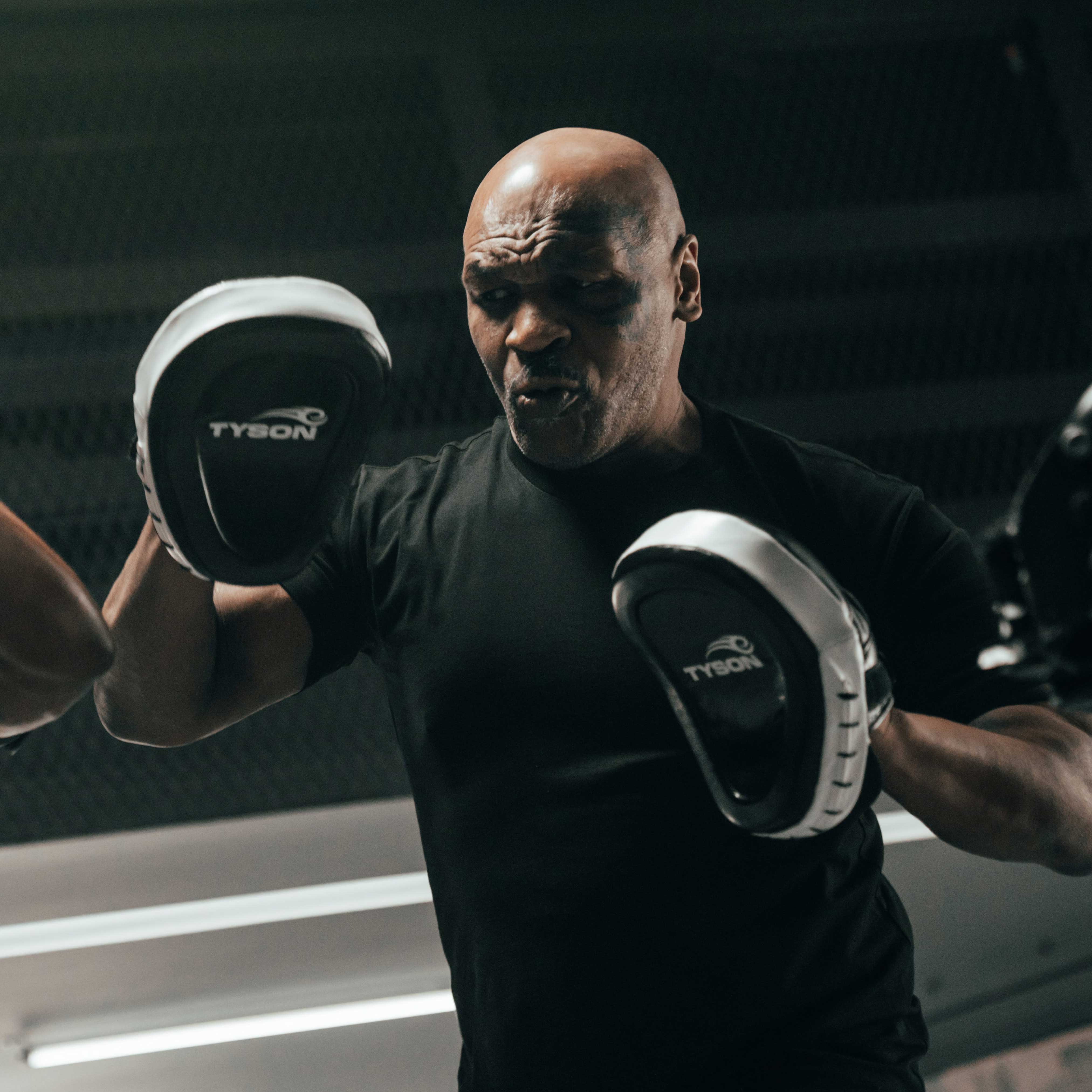 Mike Tyson using the Tyson Pro Focus Mitts. 