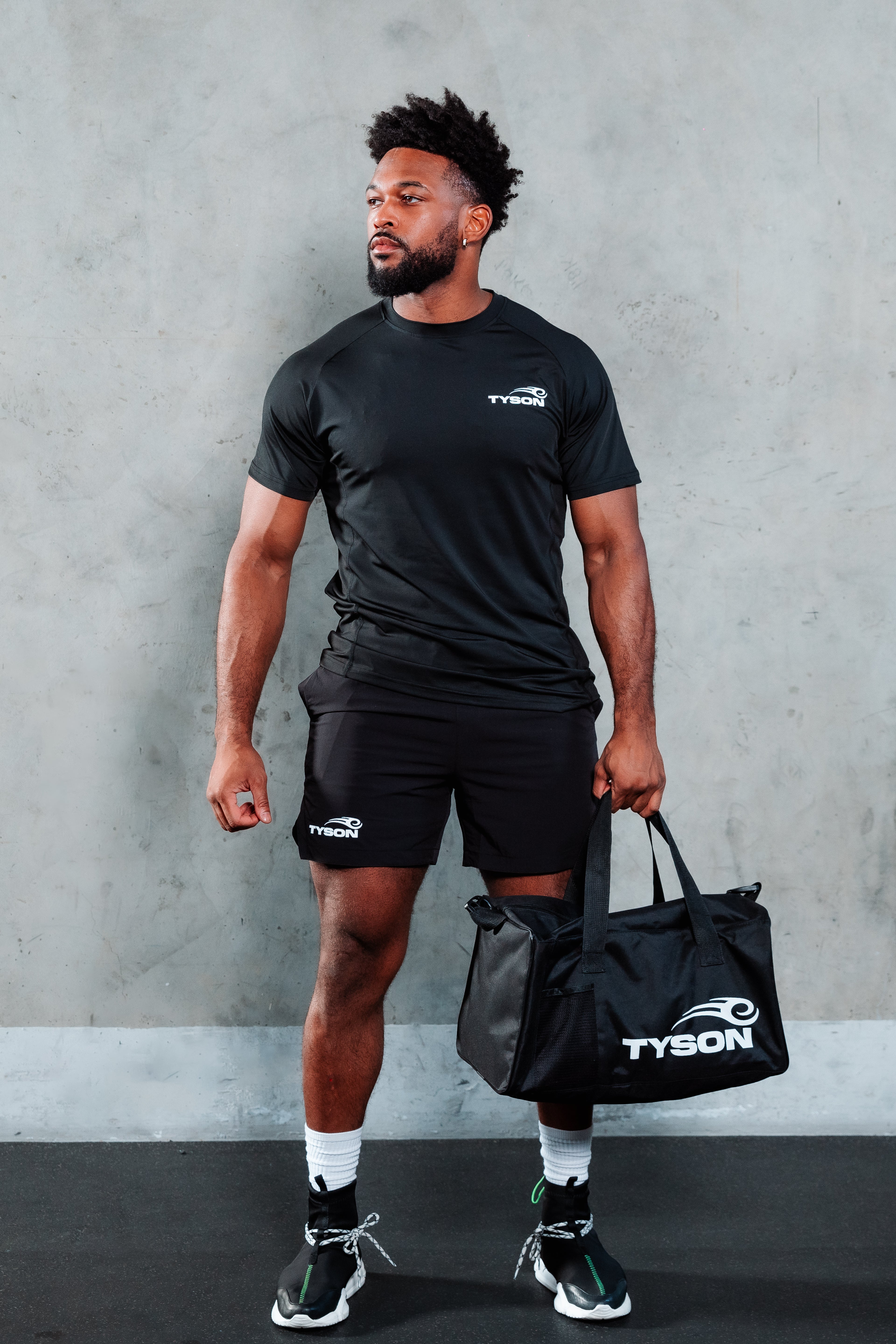 Model carrying the Tyson Pro Gym Bag.