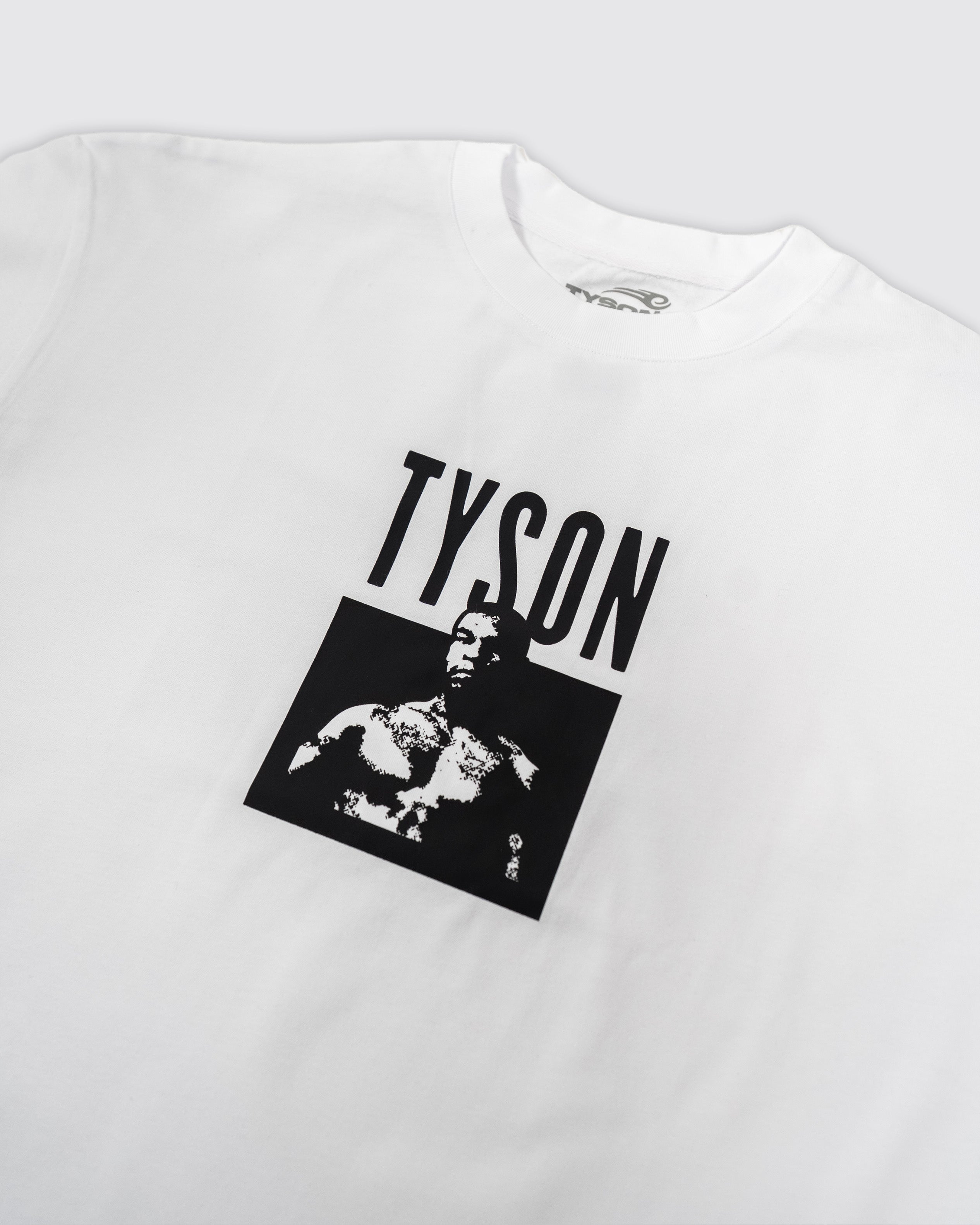 White t-shirt with small black "Tyson" text across the chest, and a black and white image of Mike below. 