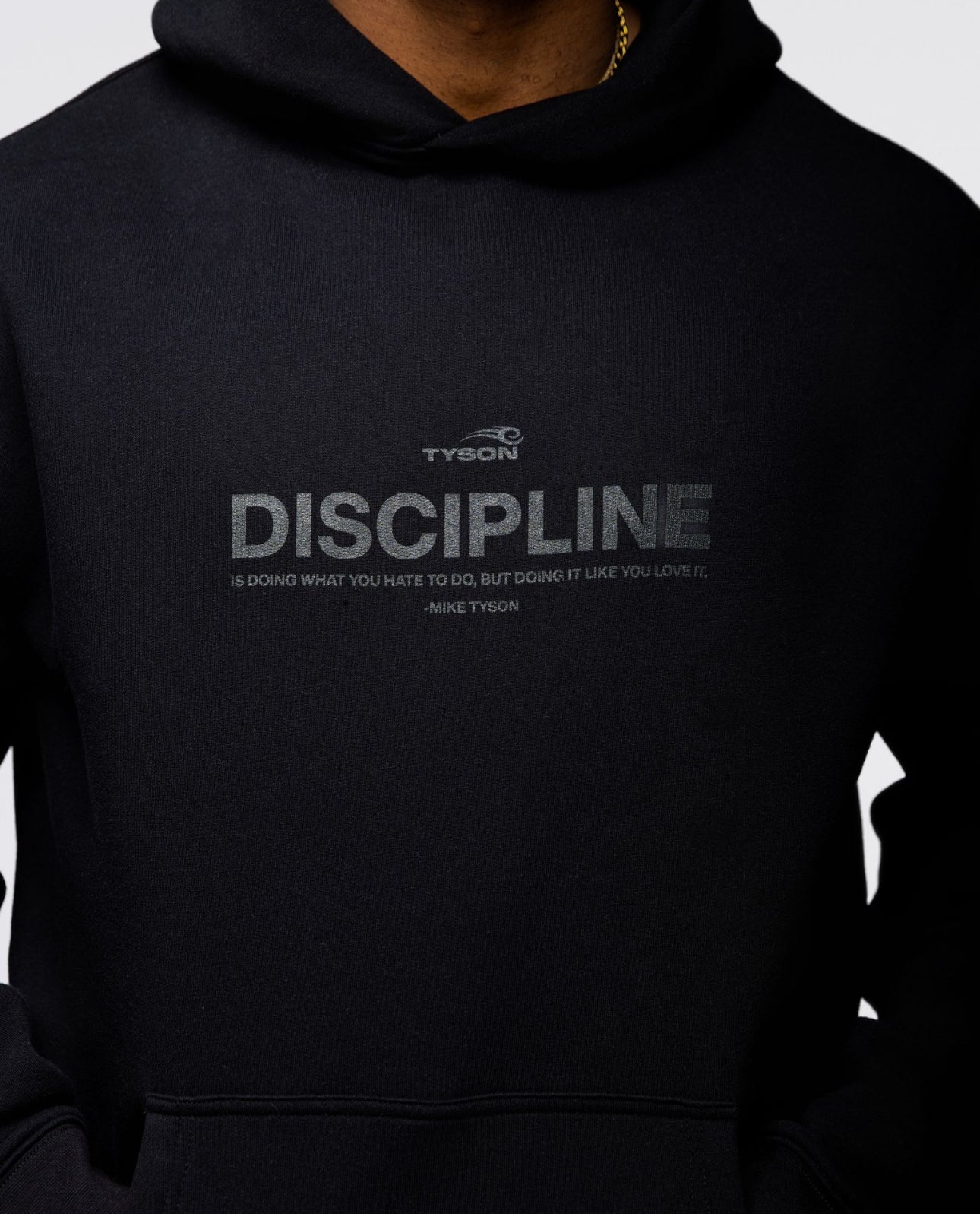 Black hoodie with the large text "Discipline" written across the chest, with the remainder of the quote "is doing what you hate to do, but doing it like you love it - Mike Tyson" written smaller below.