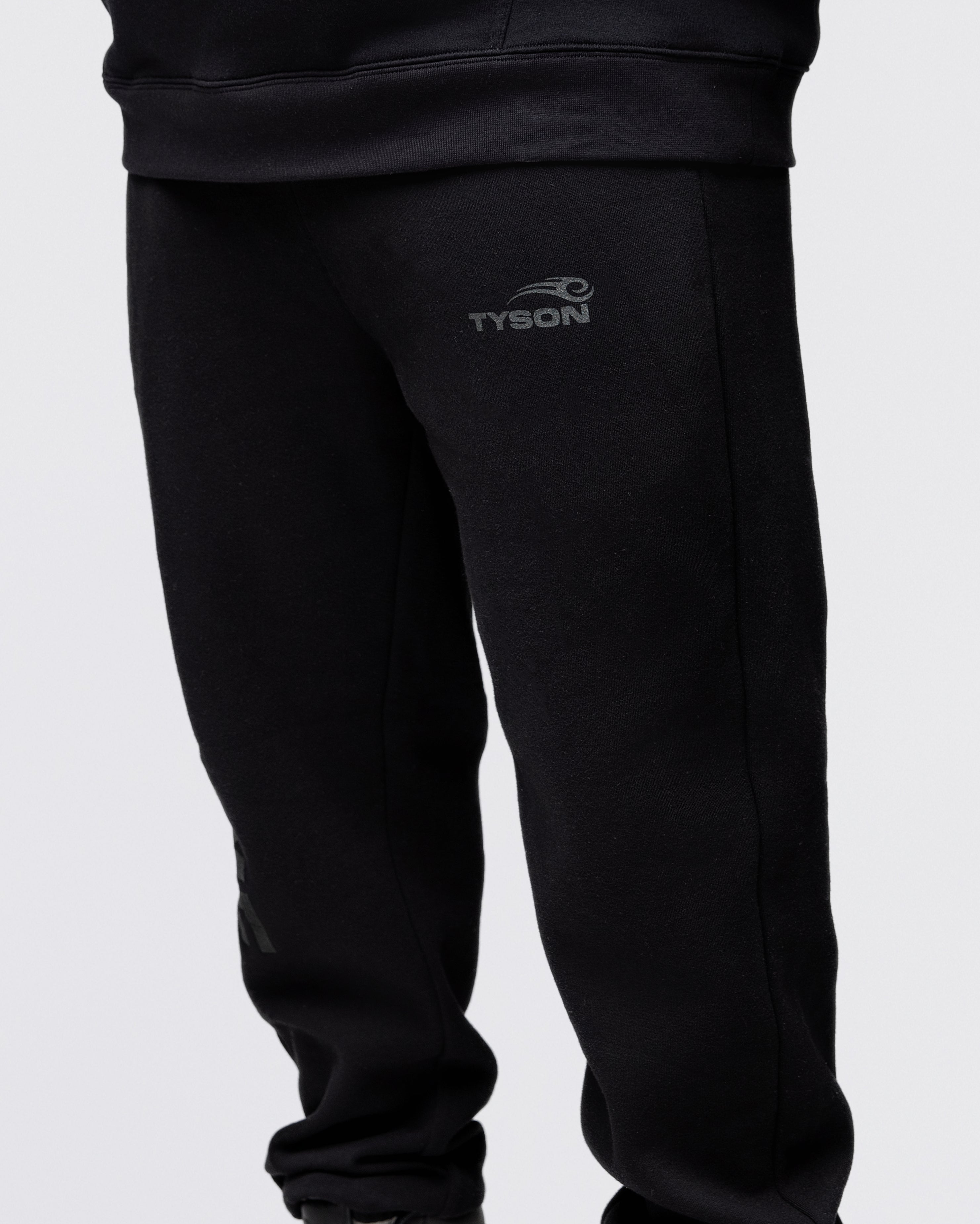 Black sweatpants featuring the large text "Discipline" running down the right leg. The Tyson Pro logo is featured on the left leg pocket area.