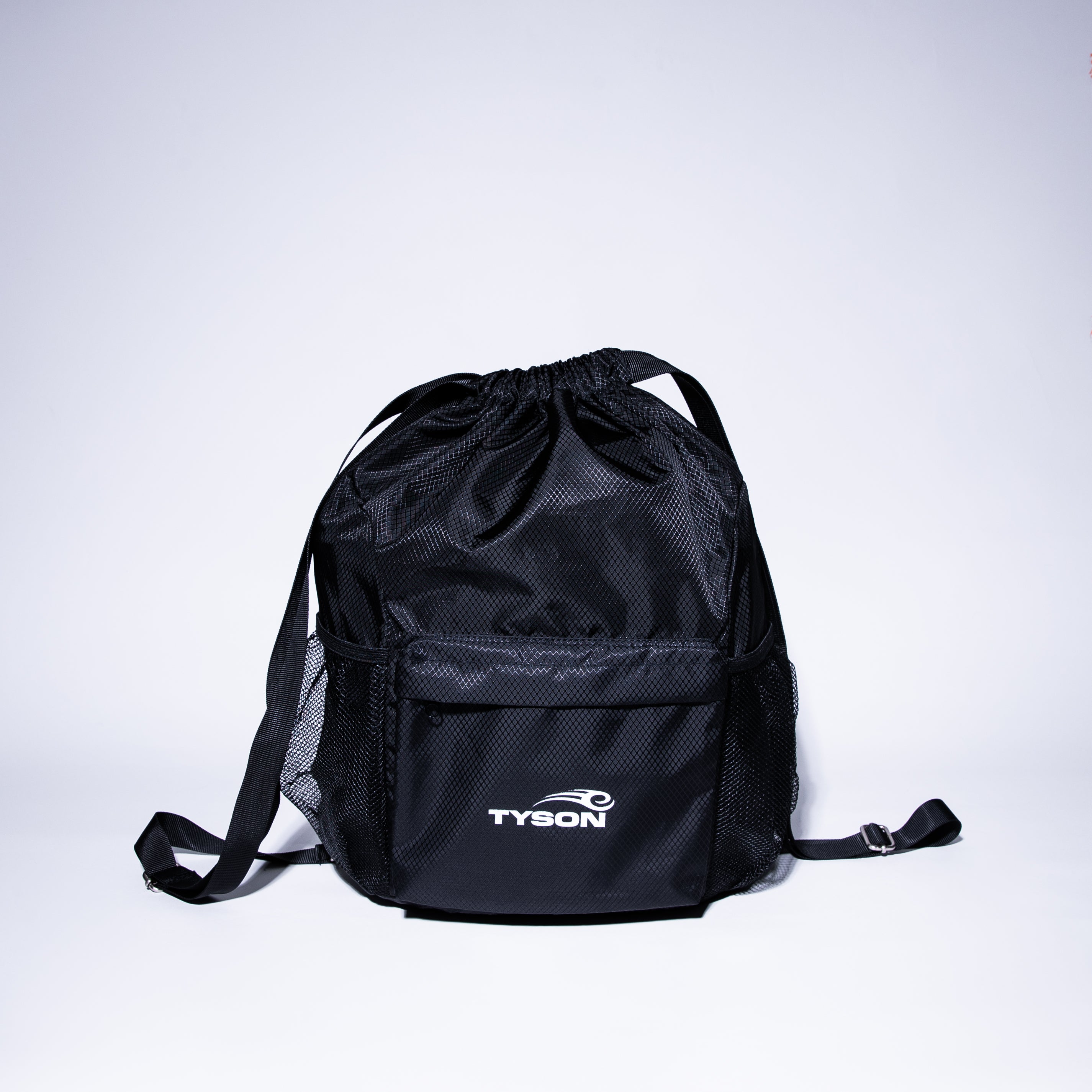 Black drawstring bag featuring the Tyson Pro logo in white on the front pocket panel. The bag has two mesh pockets on either side. 