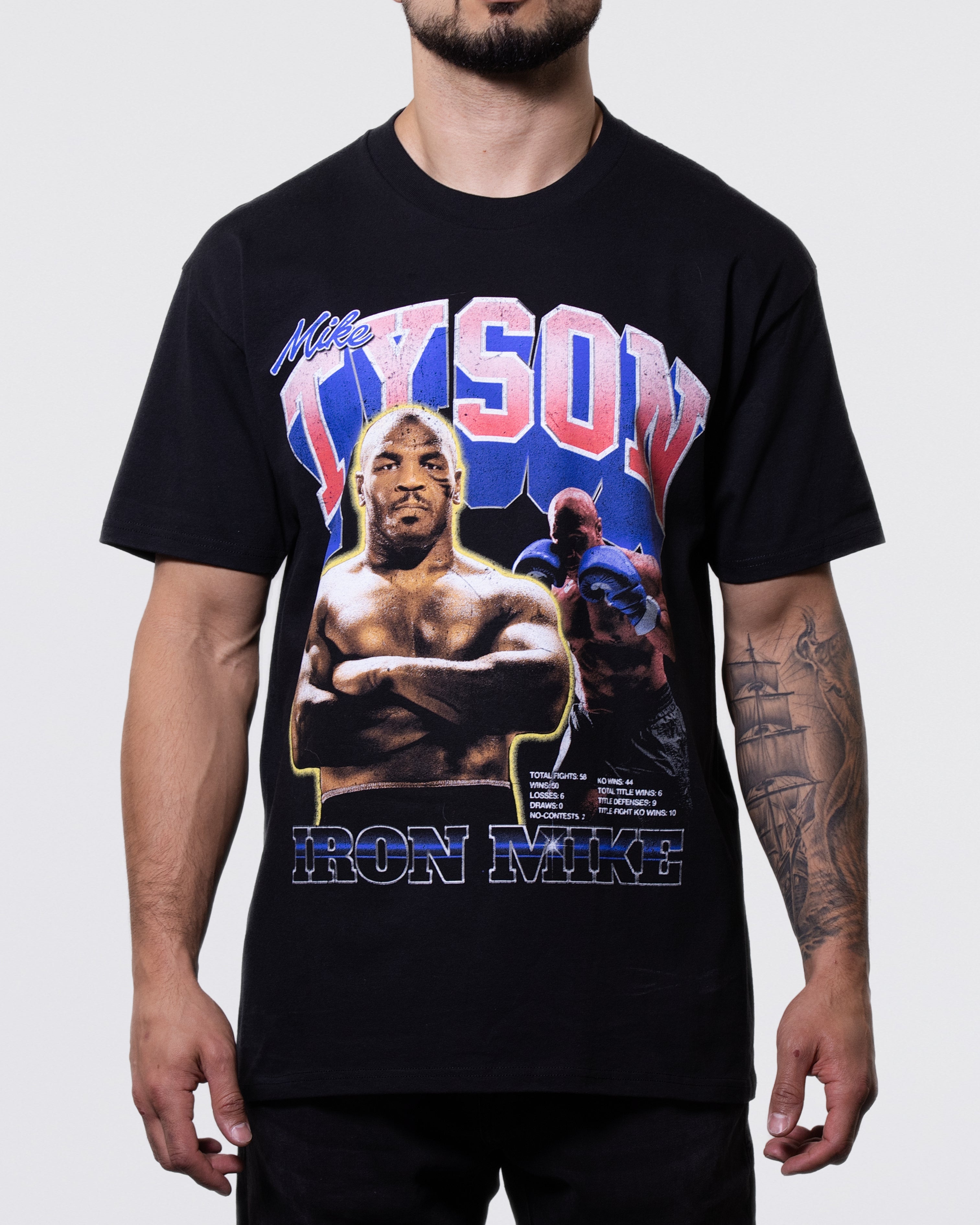 Black T-Shirt with an image of Mike looking forward. More images if Mike are in the background. "Tyson" is written across the top.