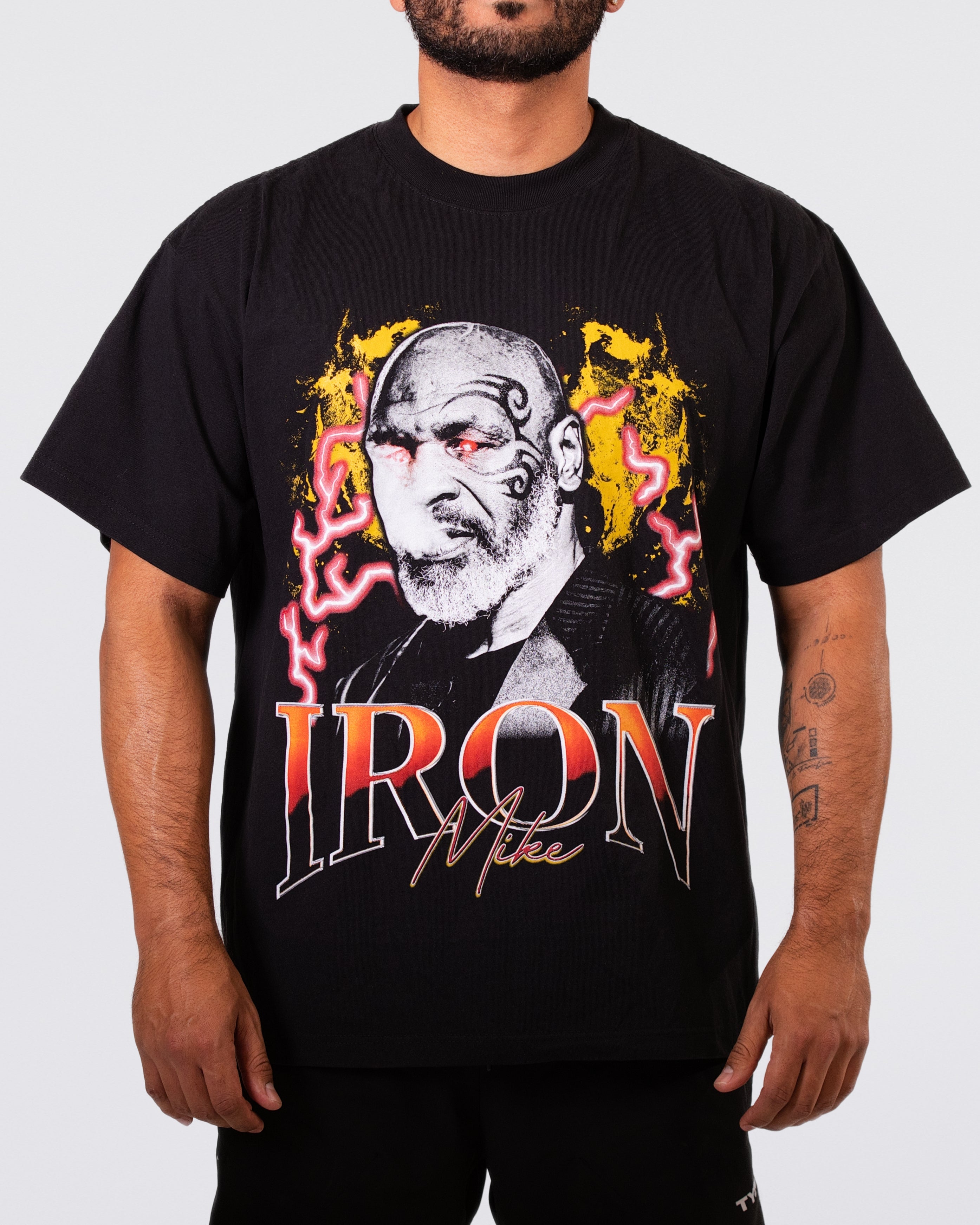 Black T-shirt with an image of Mike Tyson with red eyes and blowing smoke. Text below the images says "Iron Mike."