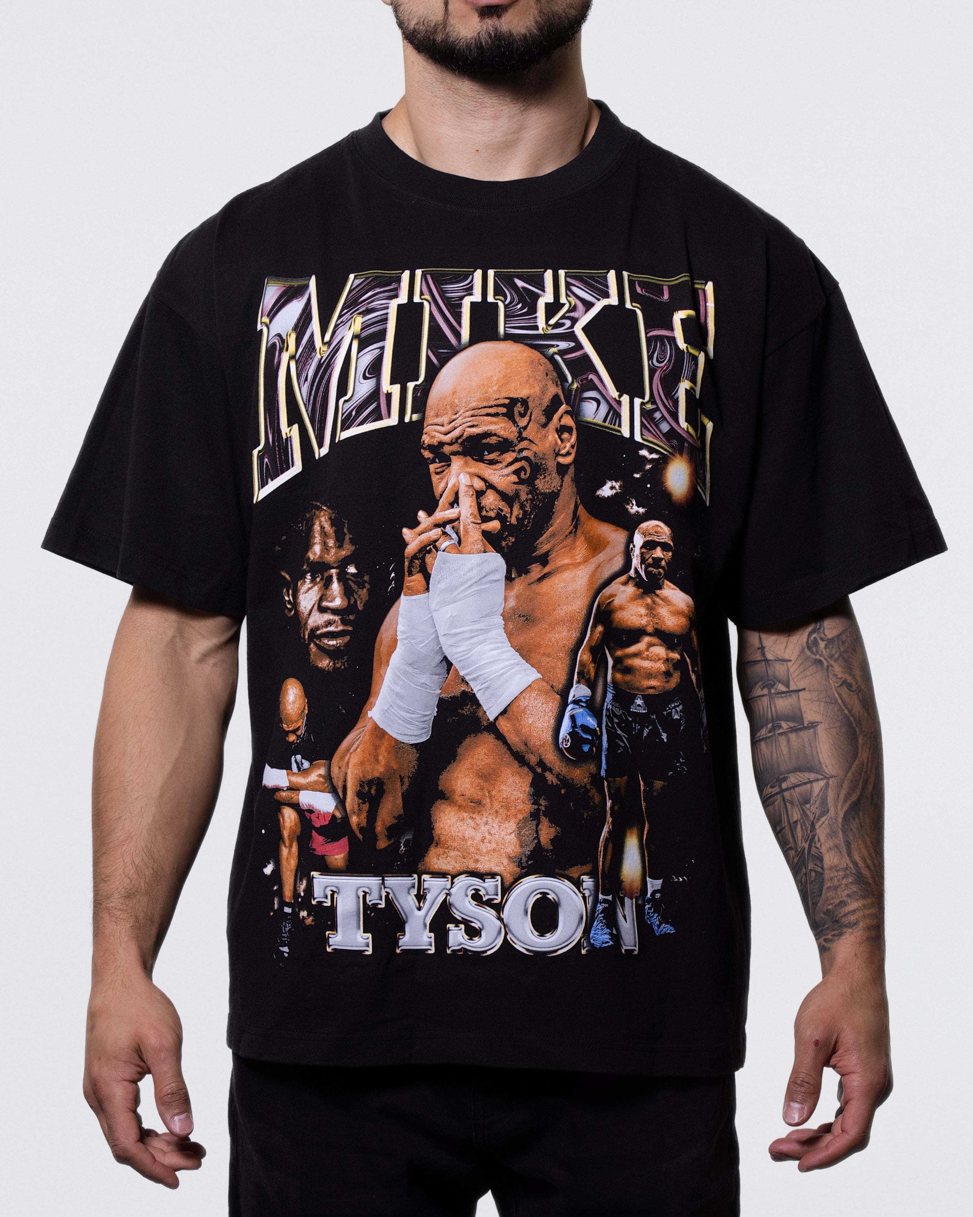 Black T-shirt with 4 images of Mike. Text above and below the image says "Mike Tyson."