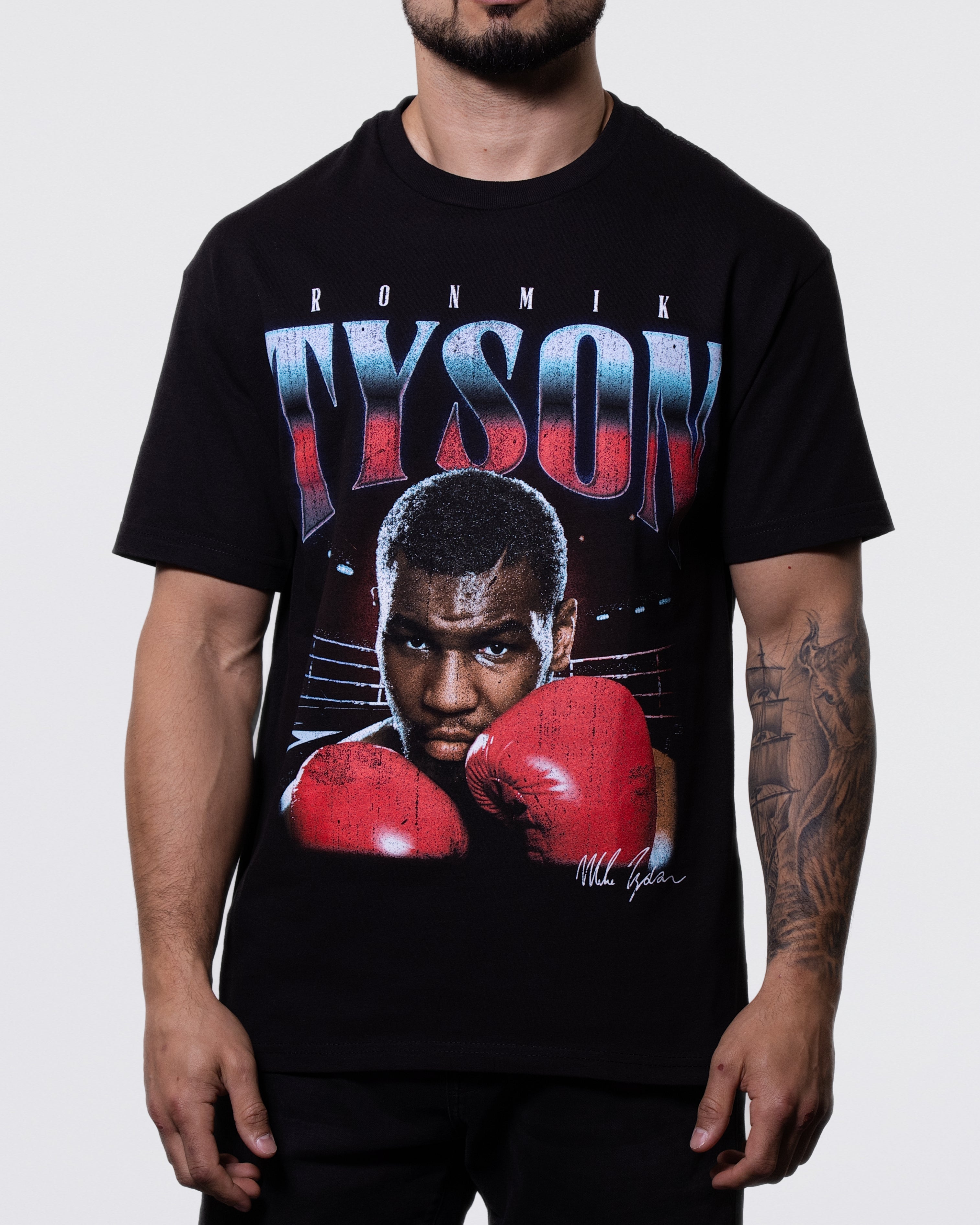 Black T-shirt with an image of Mike holding up his gloved hands, ready to punch. "Iron Mike Tyson" text across the top.