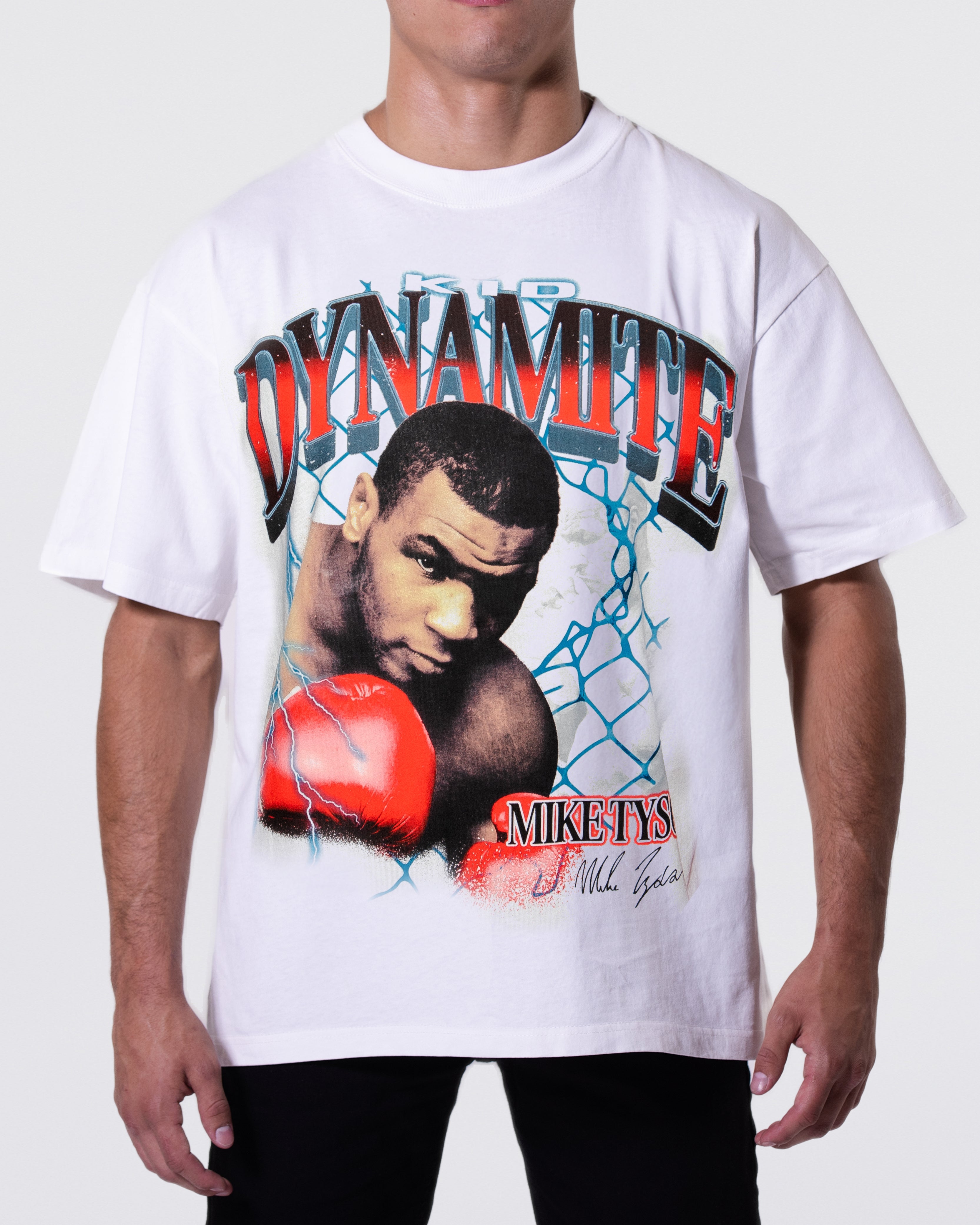 White T-shirt with an image of Mike in the center. Text above says "Kid Dynamite" and below says "Mike Tyson" with his signature.