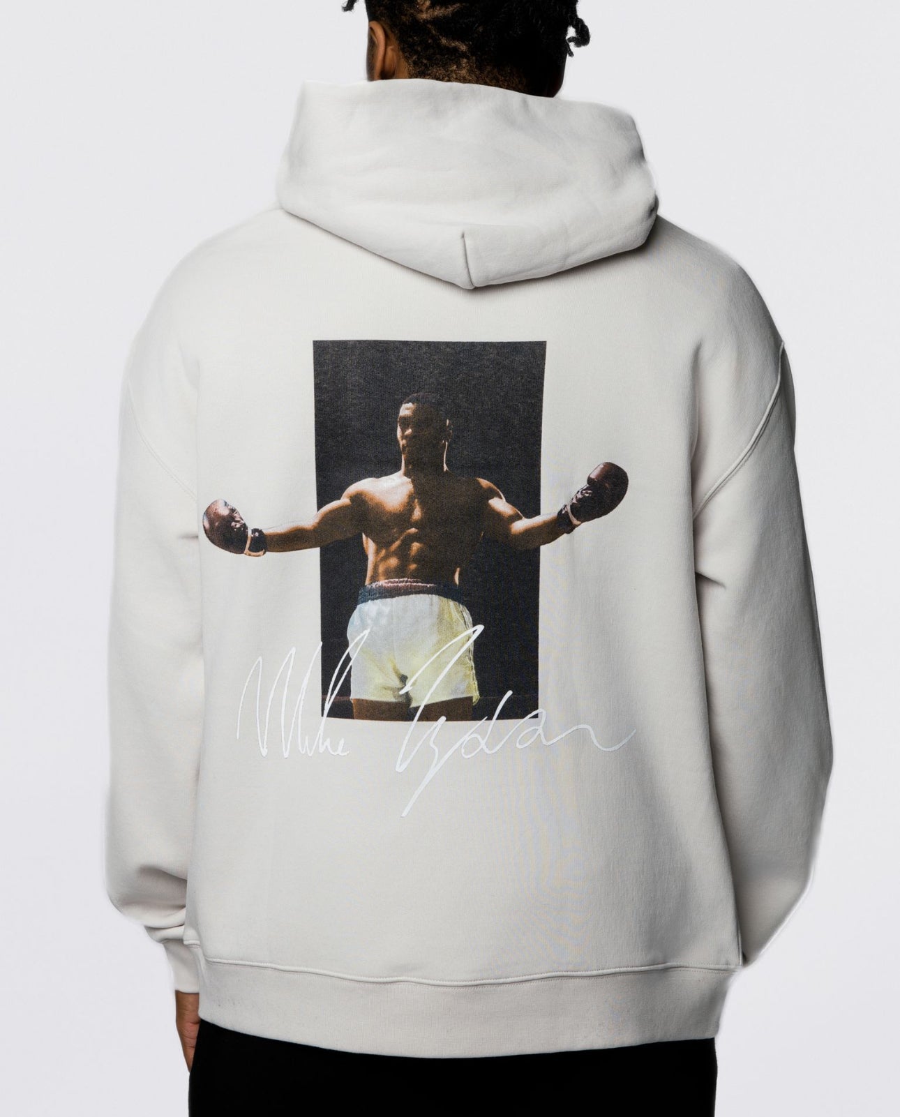 This white hoodie features Mike's signature in black on the front, and on the back, an image of him with his gloved arms outstretched in glory with his signature in white below.