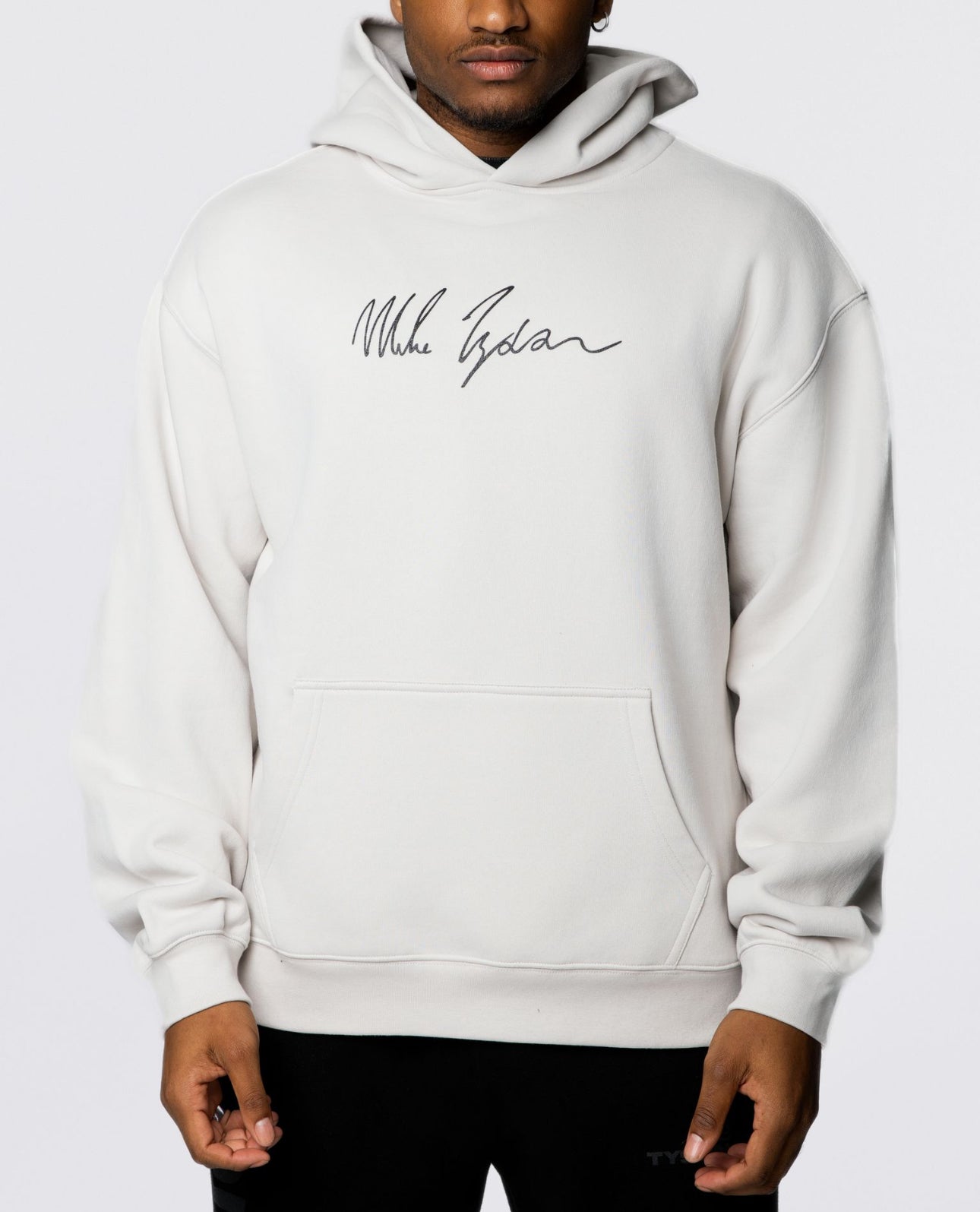 This bone colored hoodie features Mike's signature in black on the front, and on the back, an image of him with his gloved arms outstreched in glory with his signature in white below.