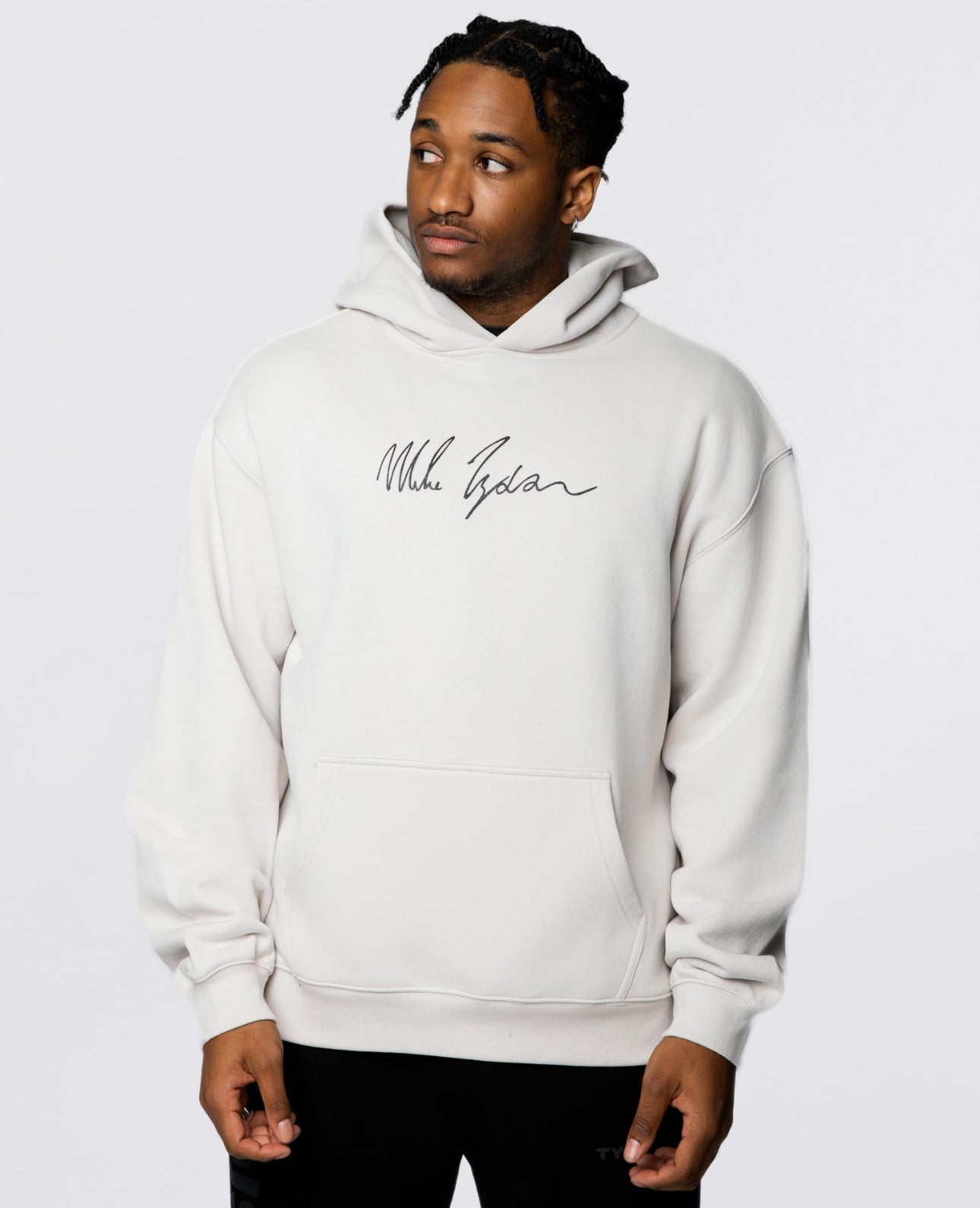 This bone colored hoodie features Mike's signature in black on the front, and on the back, an image of him with his gloved arms outstreched in glory with his signature in white below.