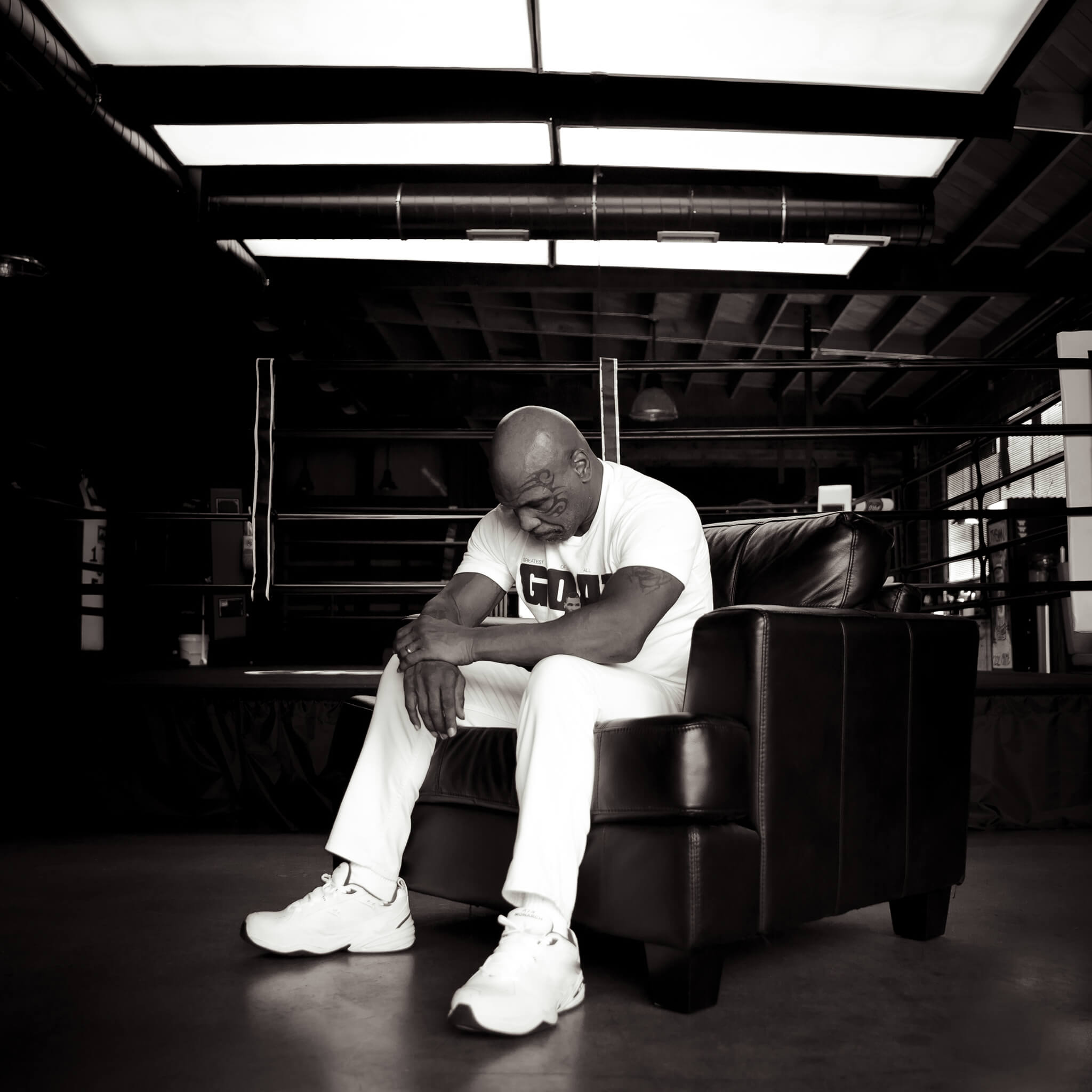 Mike Tyson thinking in a chair