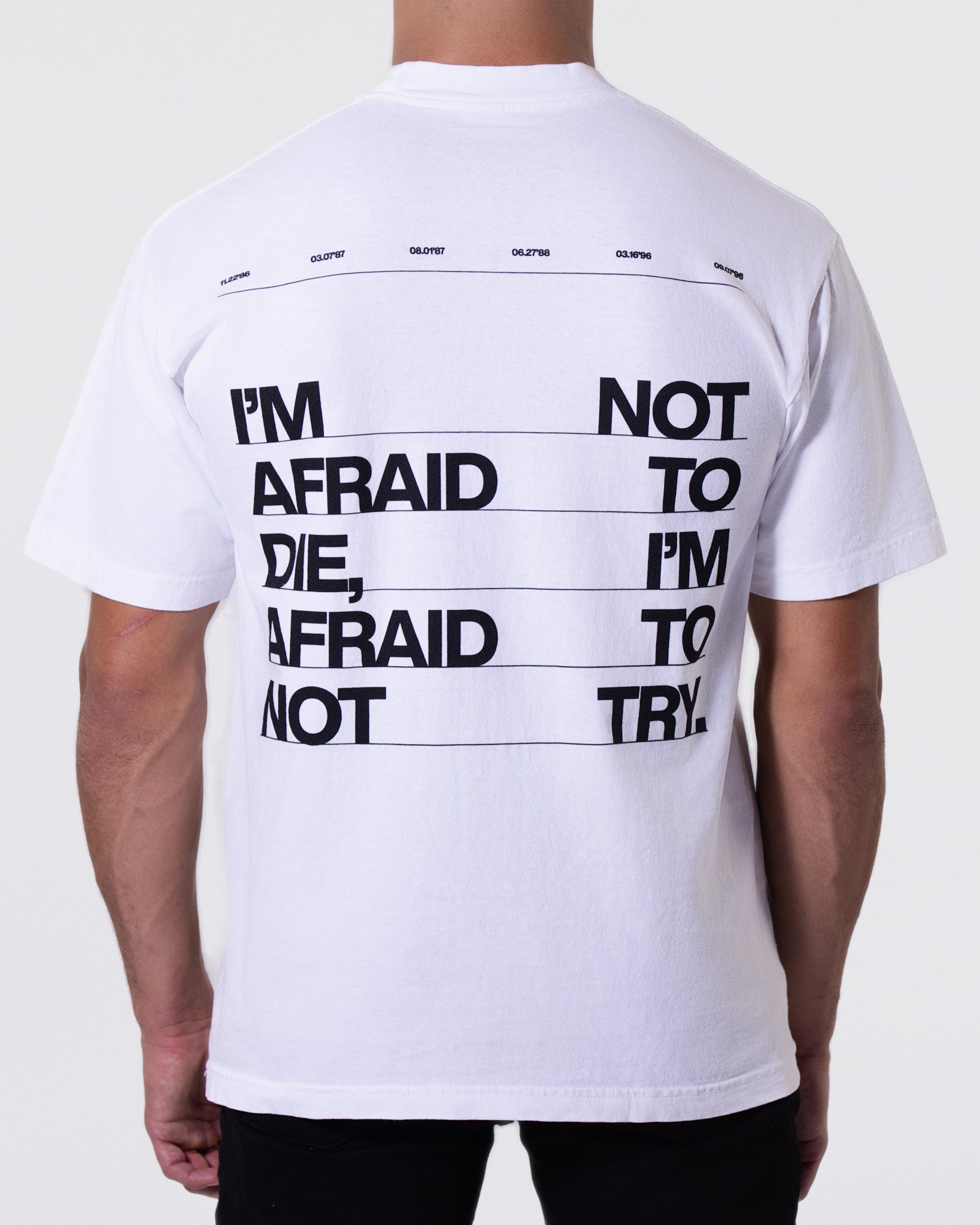 White T-shirt with the Mike Tyson quote on the back stating "I'm Not Afraid to Die, I'm Afraid to Not Try." The Mike Tyson Collection logo is below the graphic with his belt years across the top.