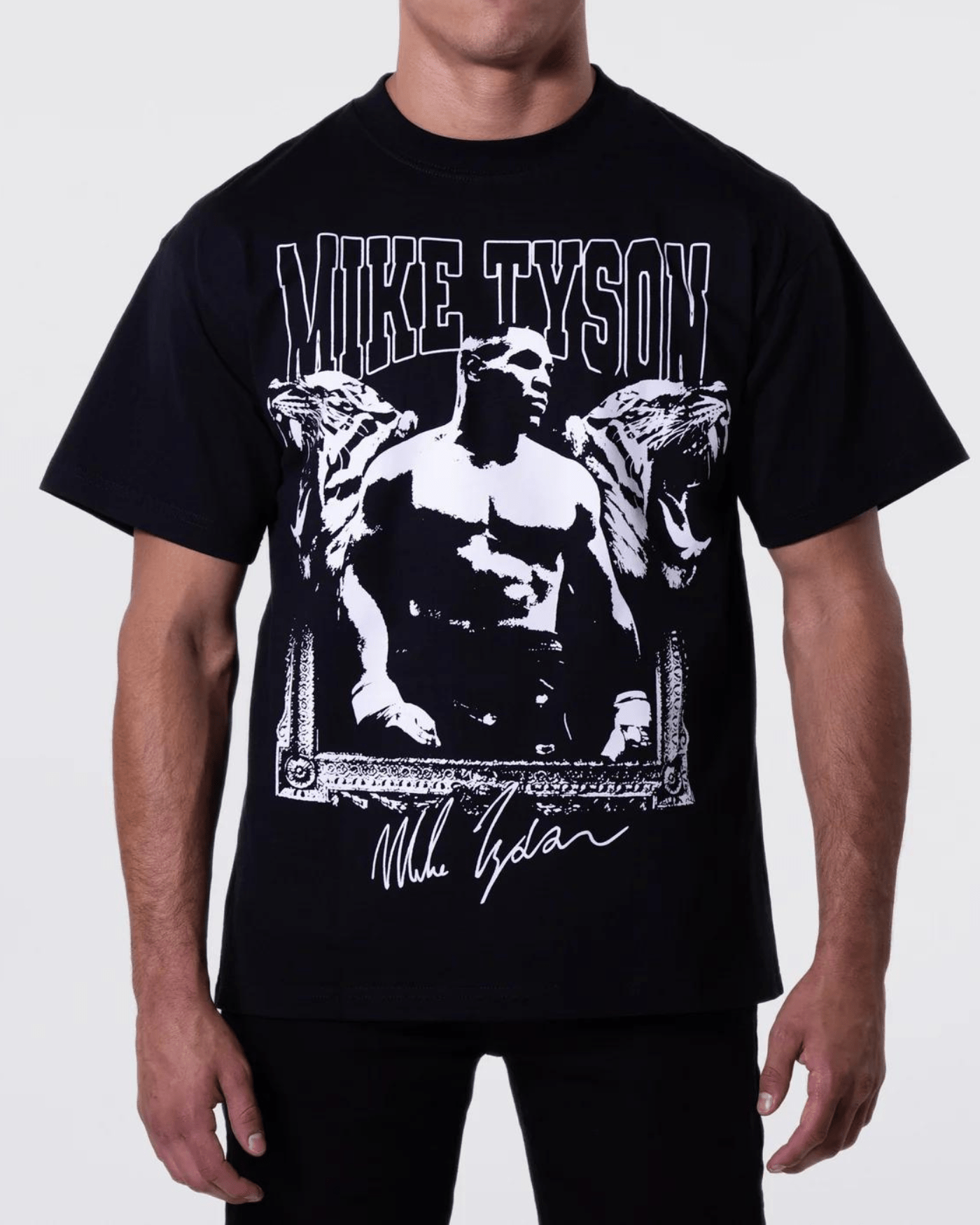 Black T-shirt with an image of Mike flanked by two roaring tigers. The top reads "Mike Tyson" and his signature is at the bottom.