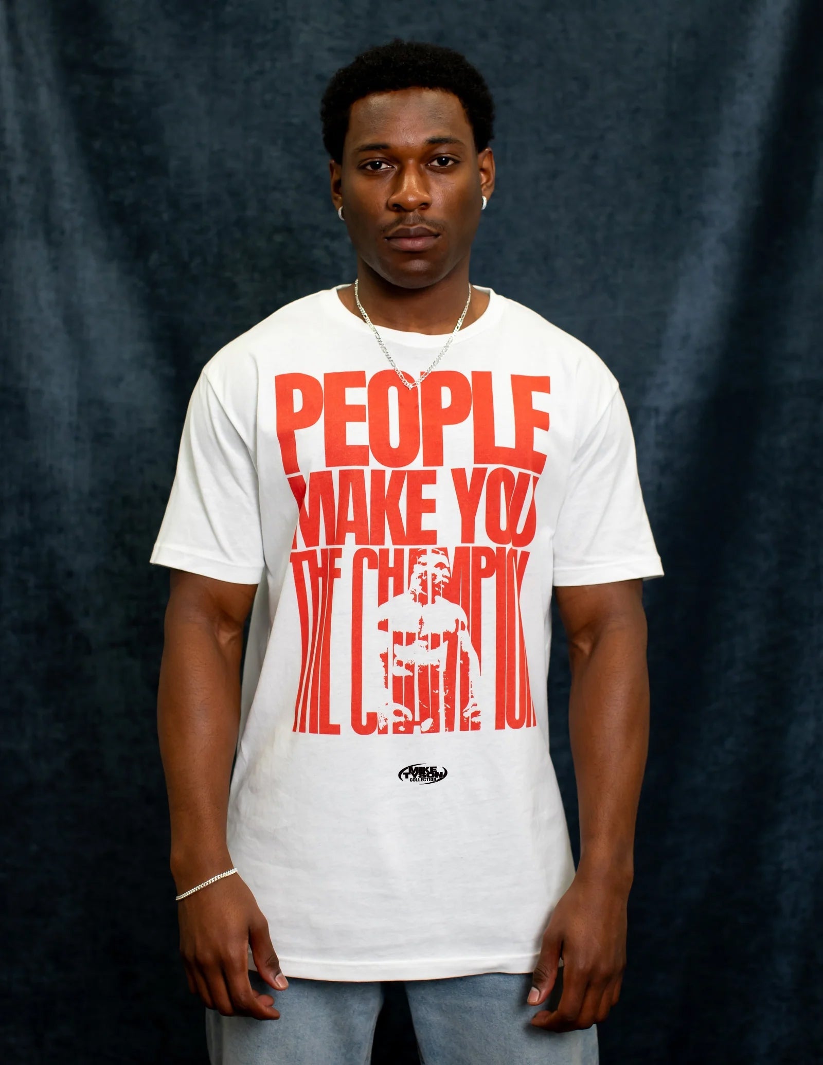 Model wearing the People Make You the Champion tee.