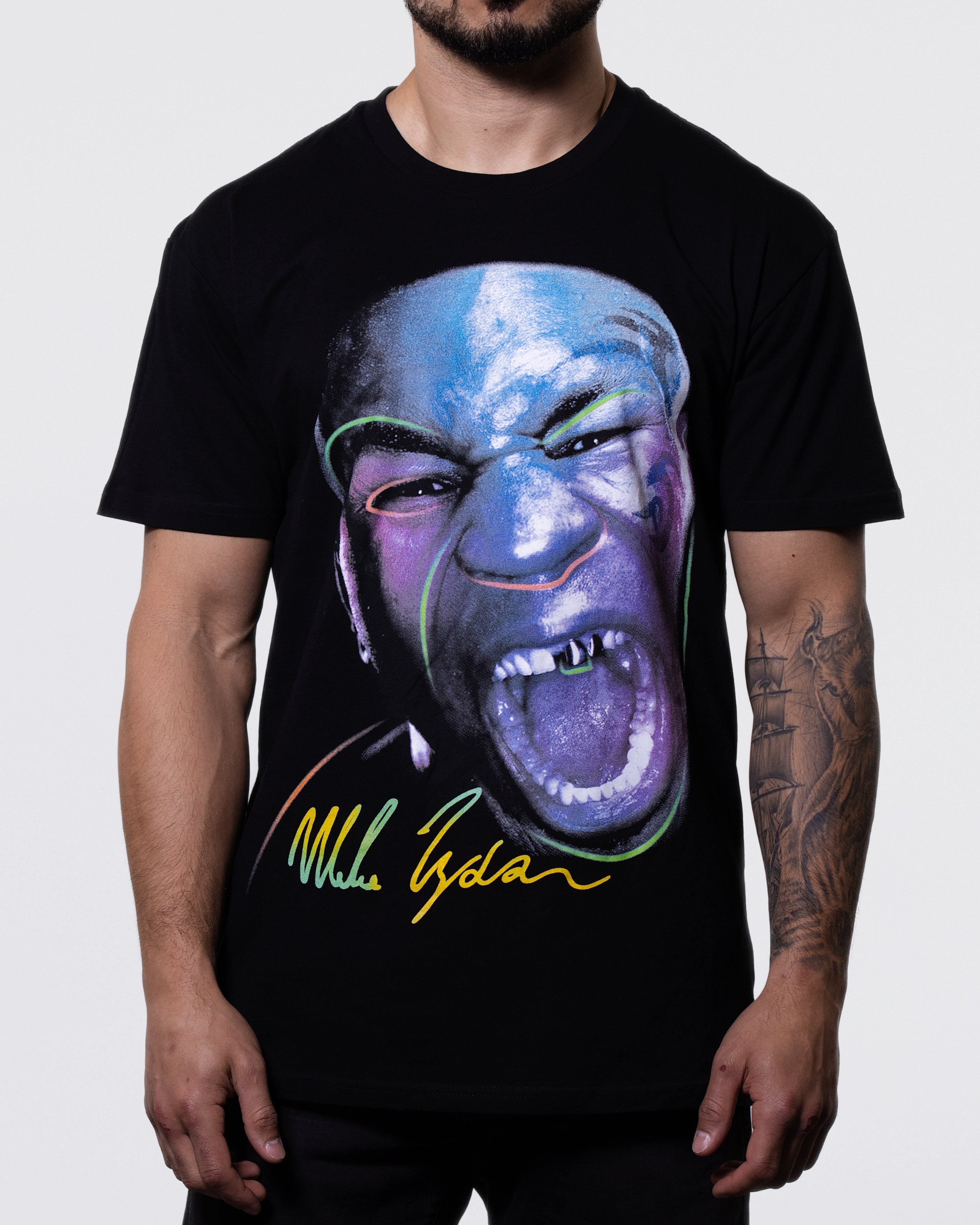 Black T-shirt with a large image of Mike's face as he is screaming towards the viewer. The image has a purple hue to it. His signature is on the bottom. 