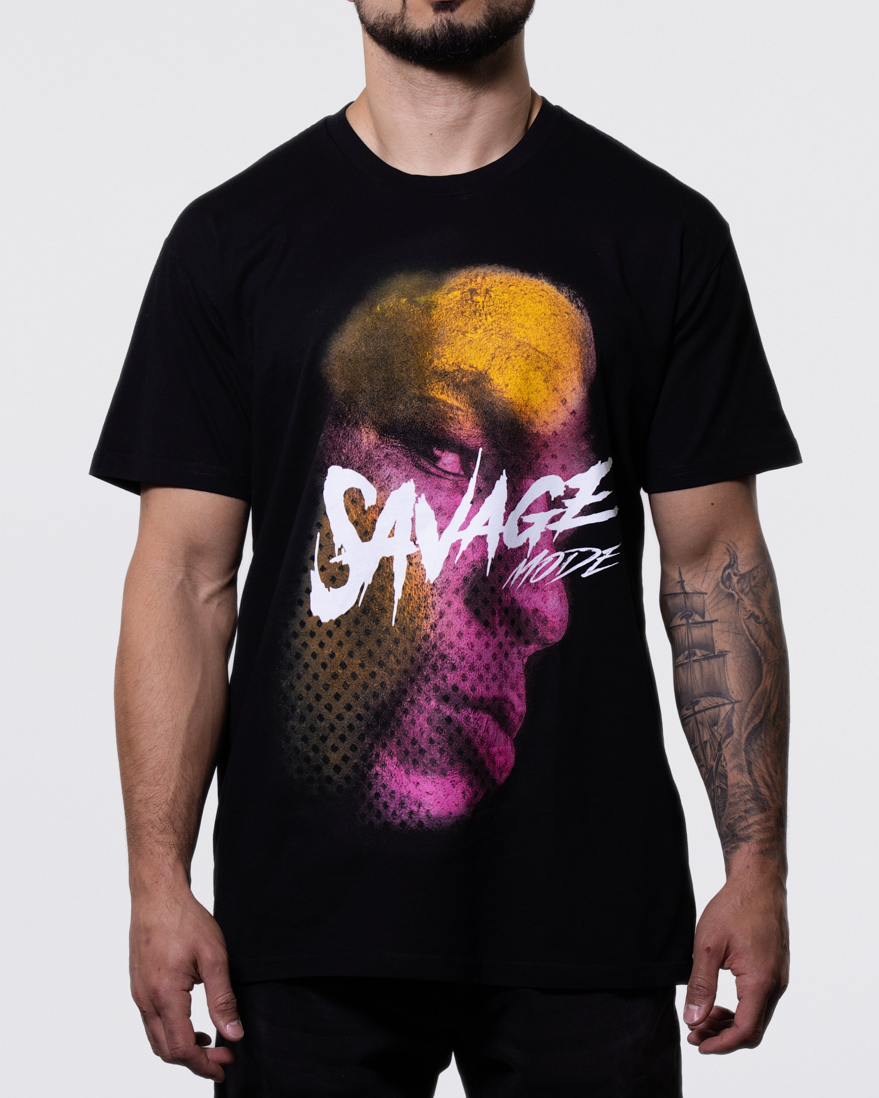 Black T-shirt with a large image of Mike's serious face. Though his face is almost in profile, his eyes are facing the viewer. The words "Savage Mode" overlay the image. 