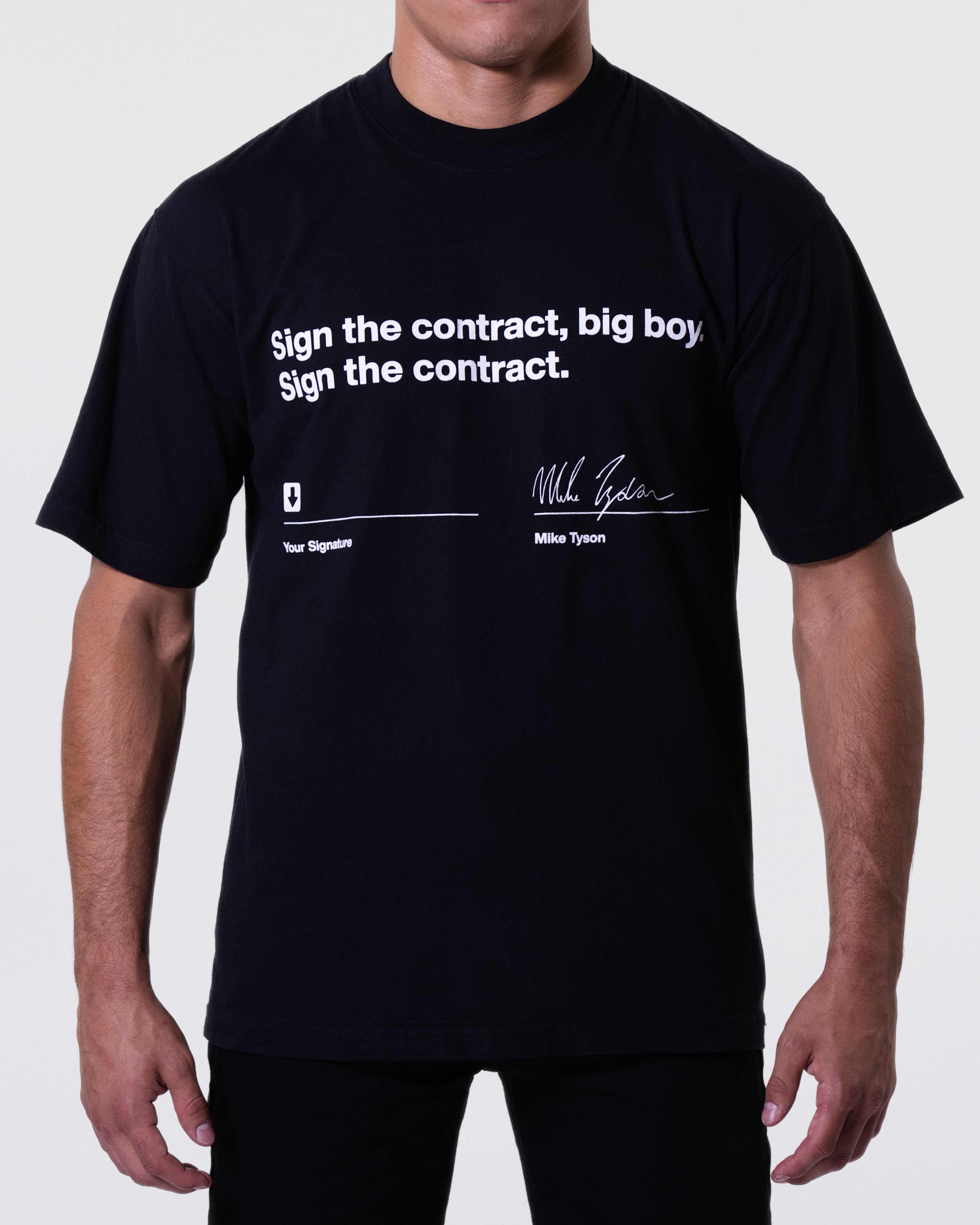 Black T-shirt with the quote "Sign the contract, big boy. Sign the contract" written across the chest. Below, there are two signature lines. One has an arrow with text below that says "Your Signature." The other has Mike Tyson's signature with his name below.