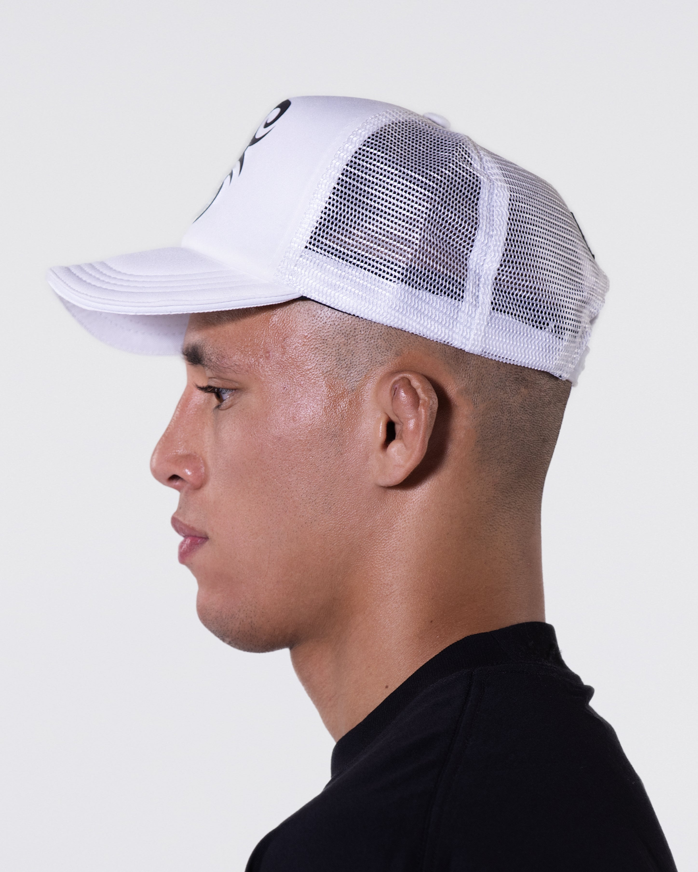 Model wearing the white Tattoo Trucker hat.