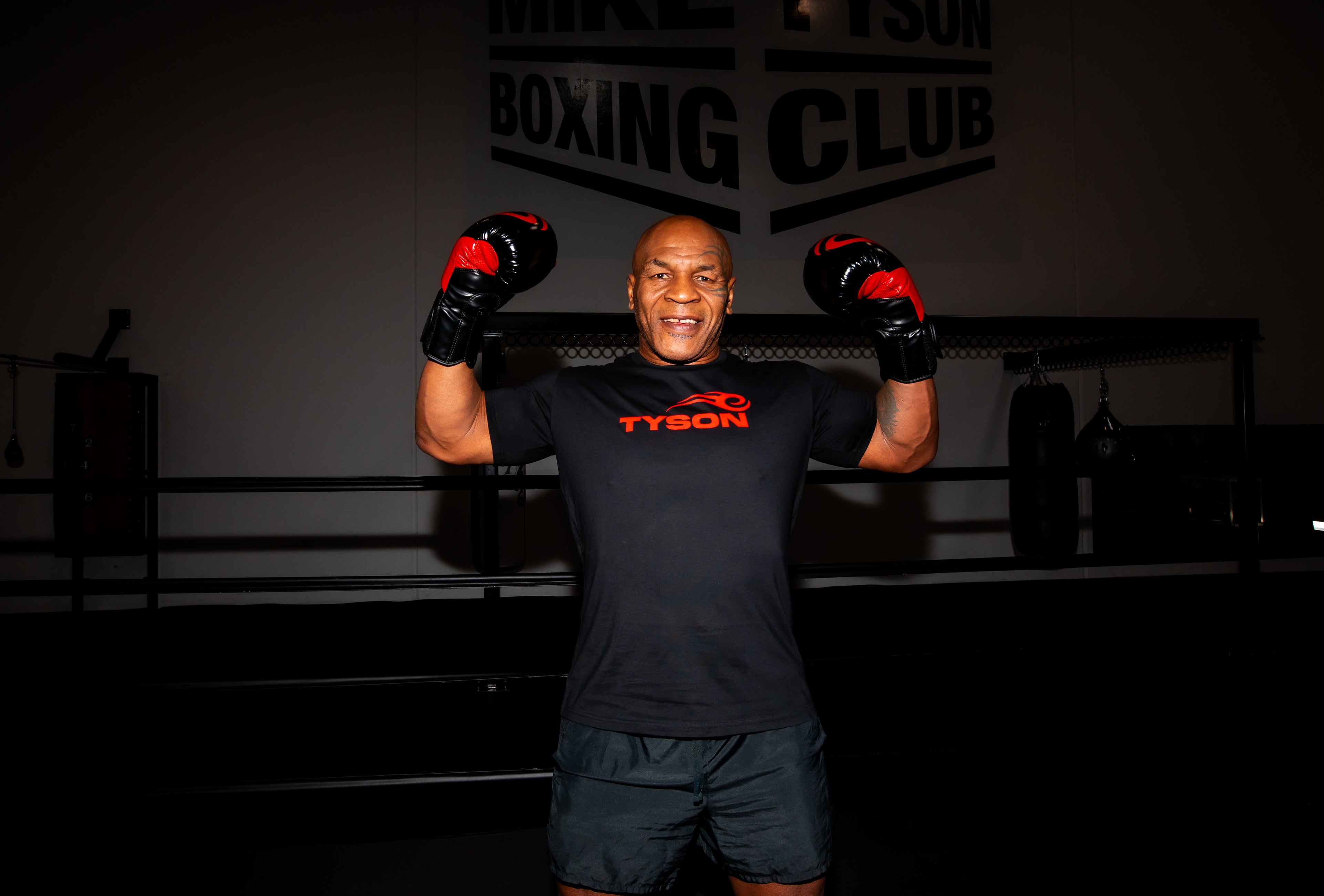 Mike Tyson wearing the Tyson Pro Cotton Shirt Black with Red Logo.