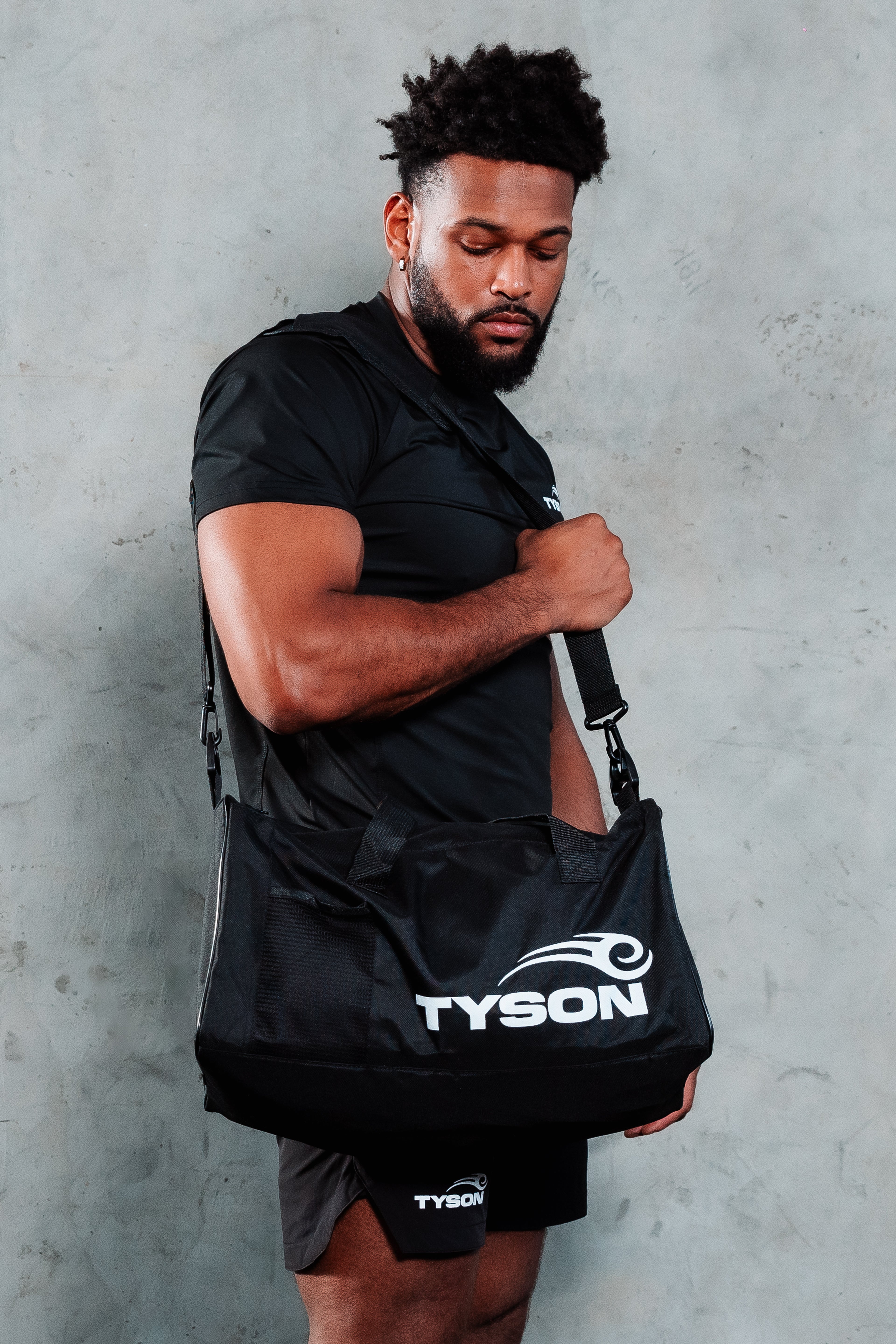 Model carrying the Tyson Pro Gym Bag.