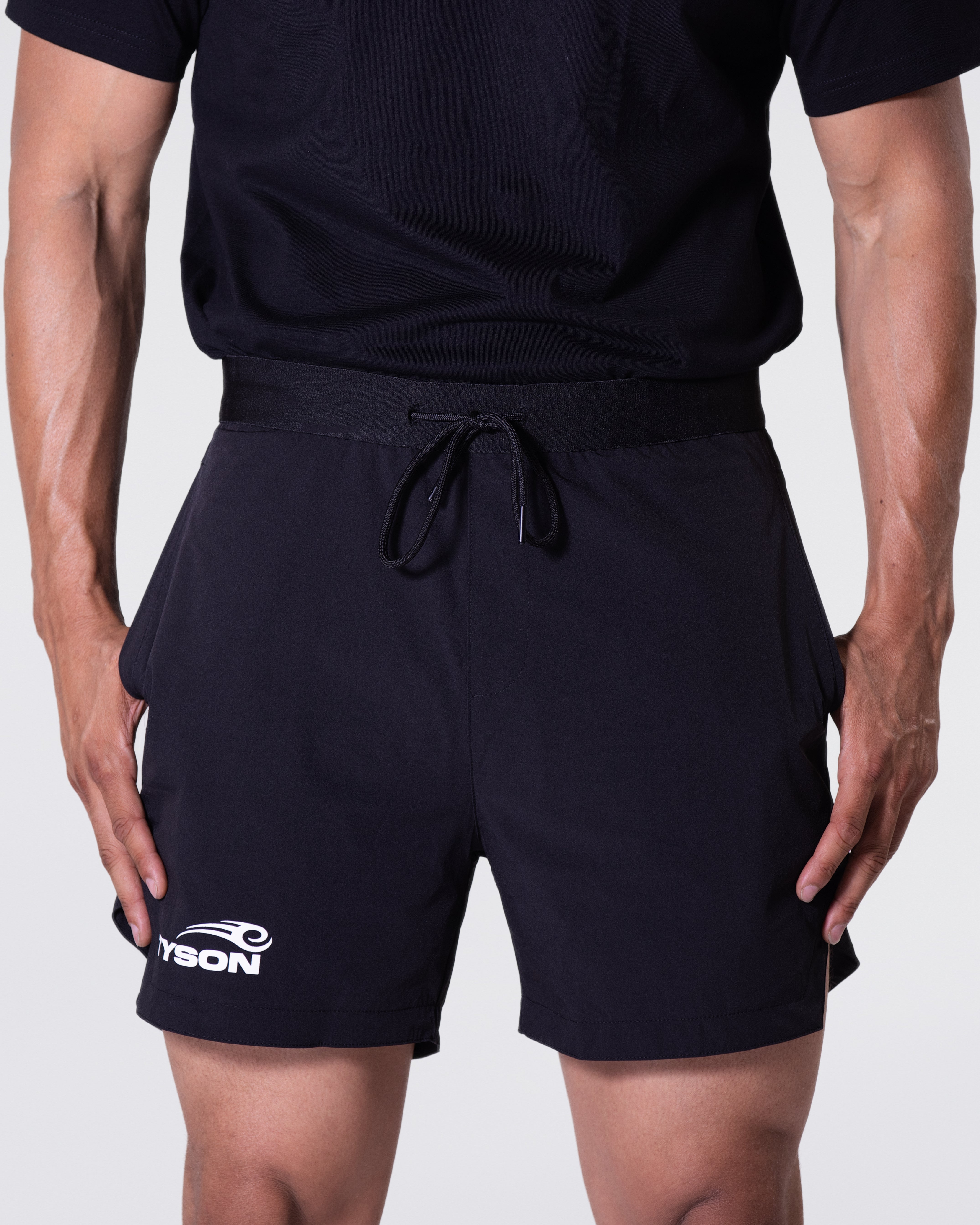 Black shorts featuring the Tyson Pro logo in white on the right thigh, just above the cuff.