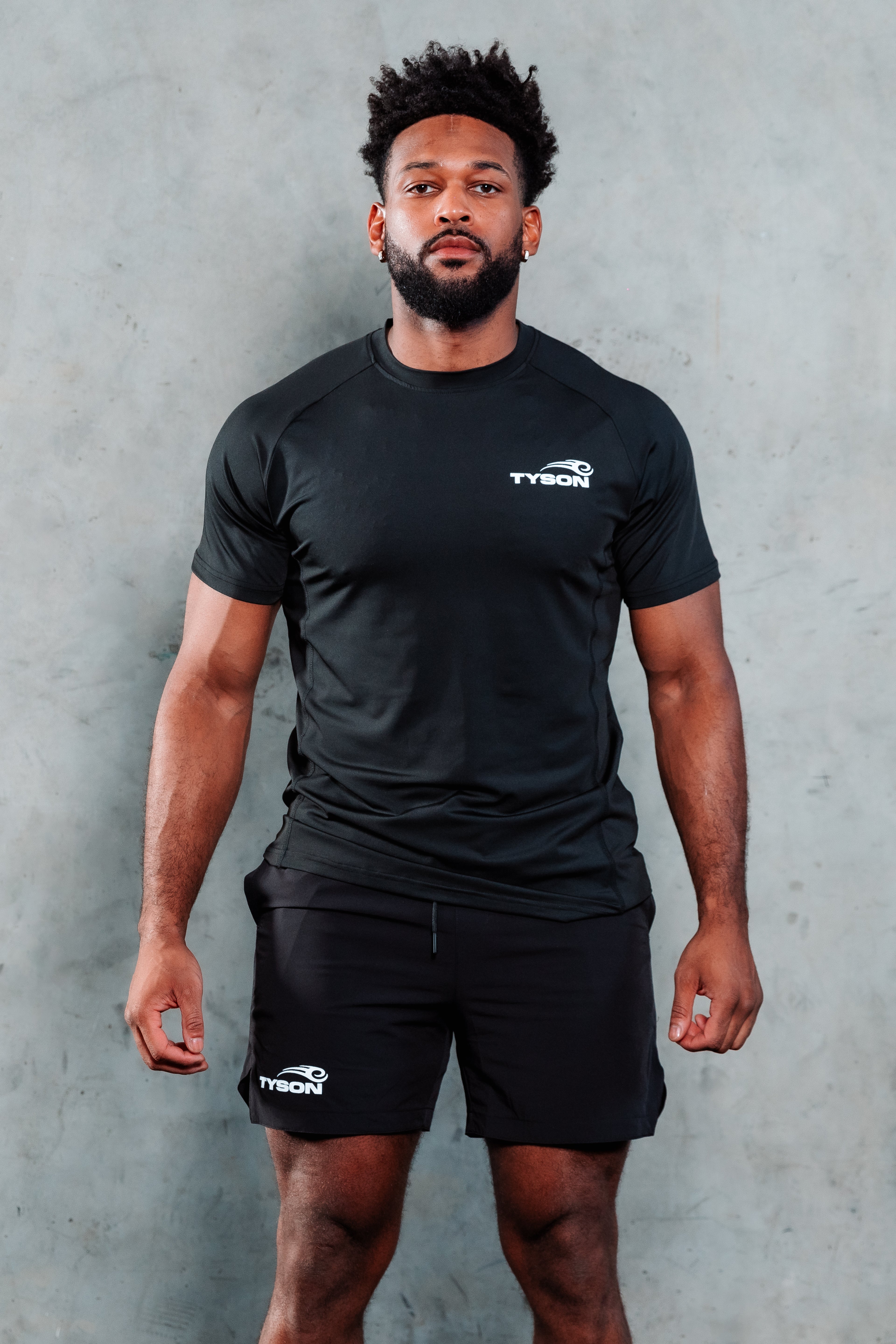 Black T-shirt featuring the Tyson Pro logo in white on the left chest area.