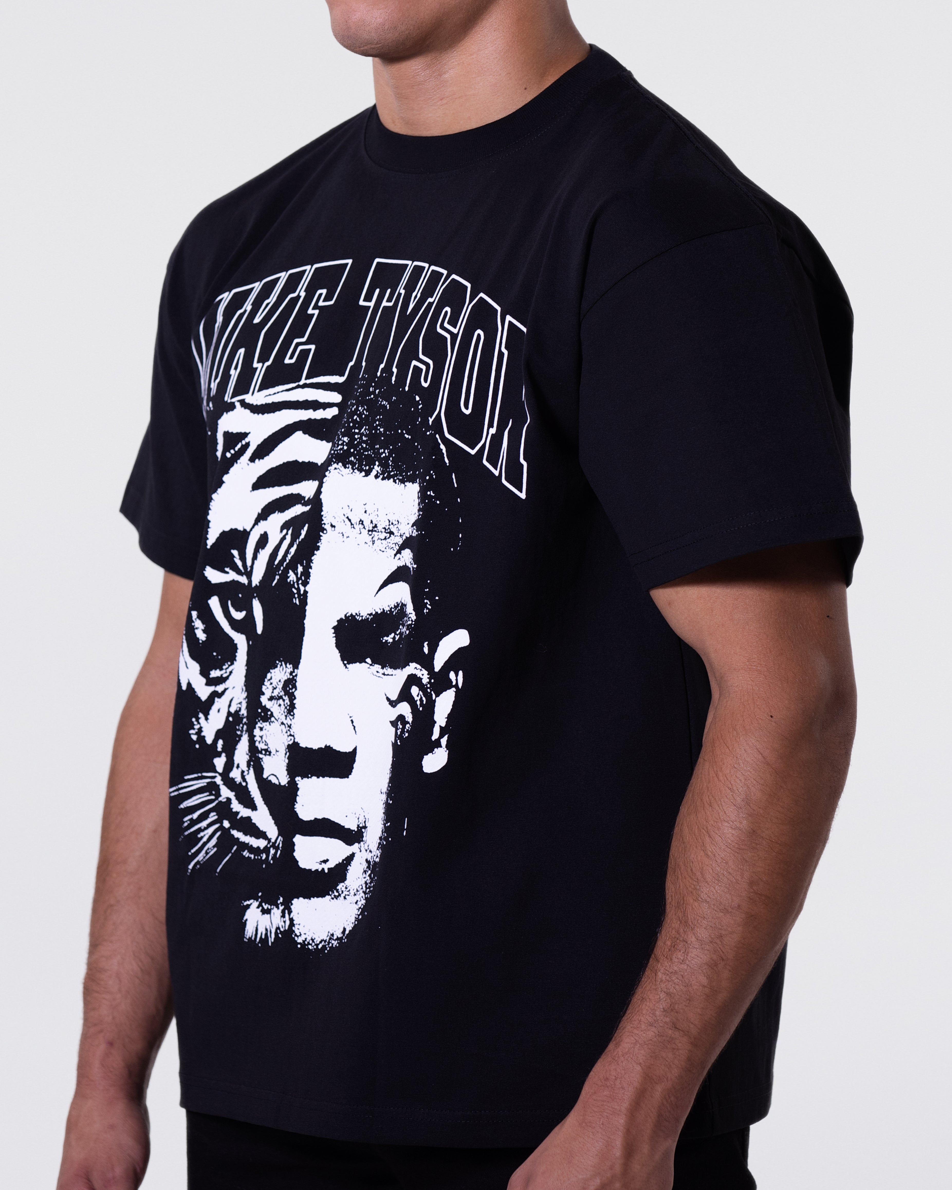 Black T-shirt with a black and white image that is half tiger and half Mike's face. "Mike Tyson" is written across the top.