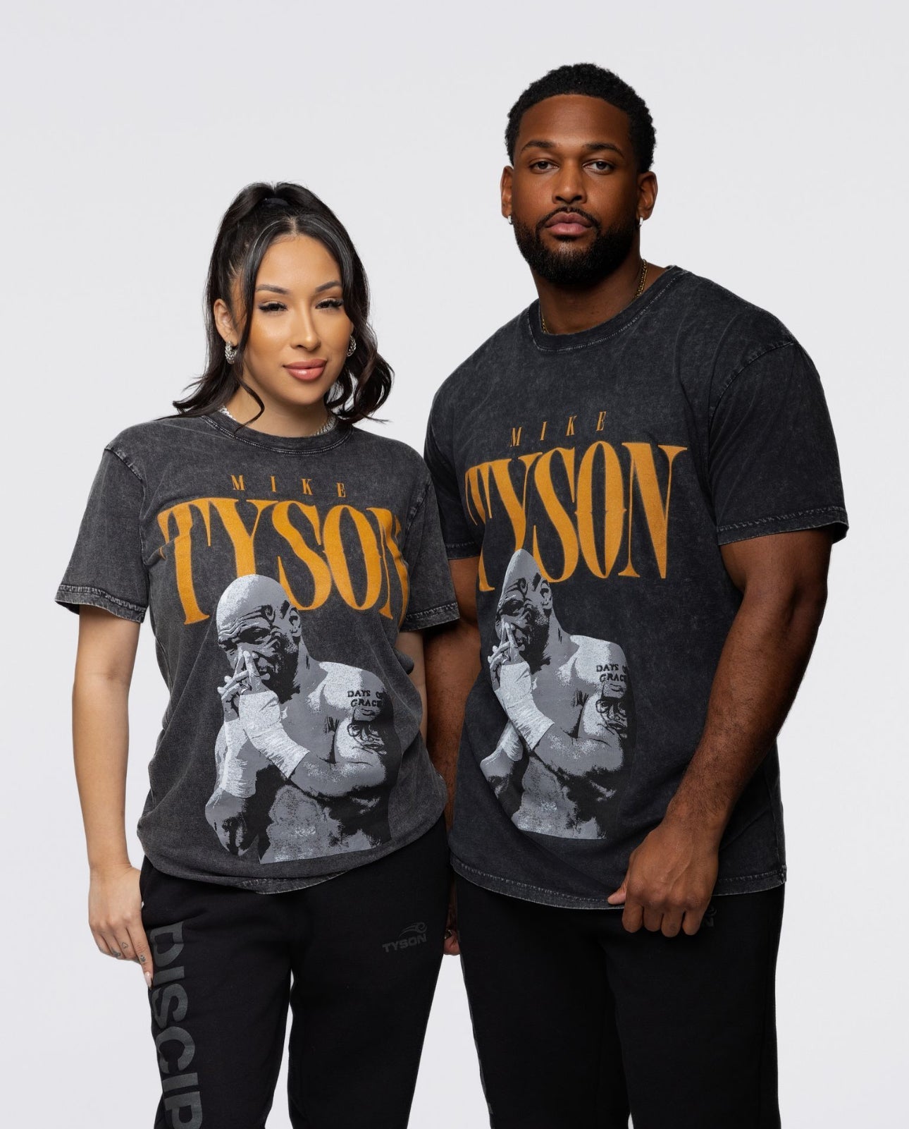 Models wearing the Vintage Tyson tee.